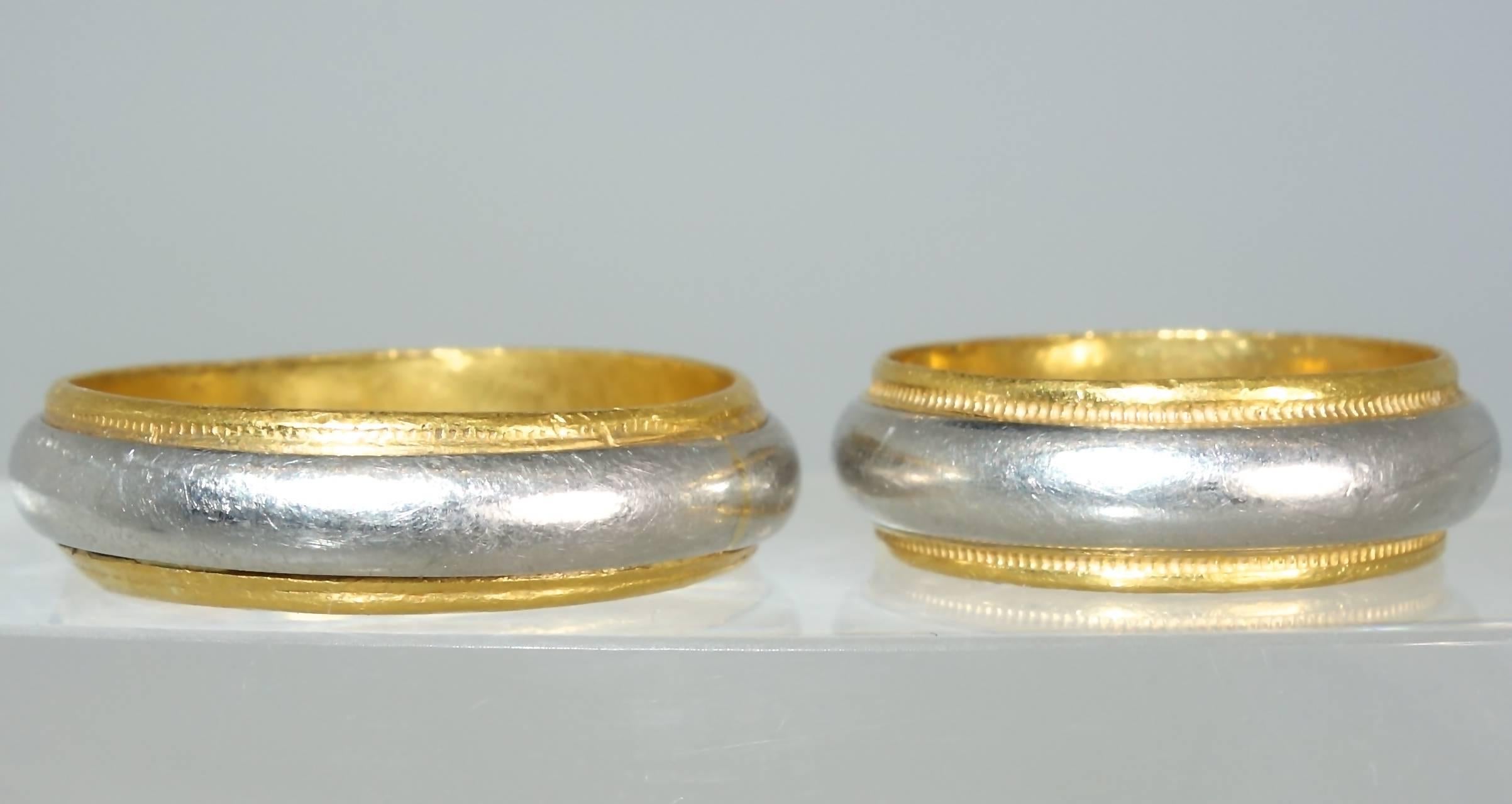 Matching wedding bands by Cartier in 24K gold and platinum.  These can be sized.  Now they are a size 10+ and a size 6+.