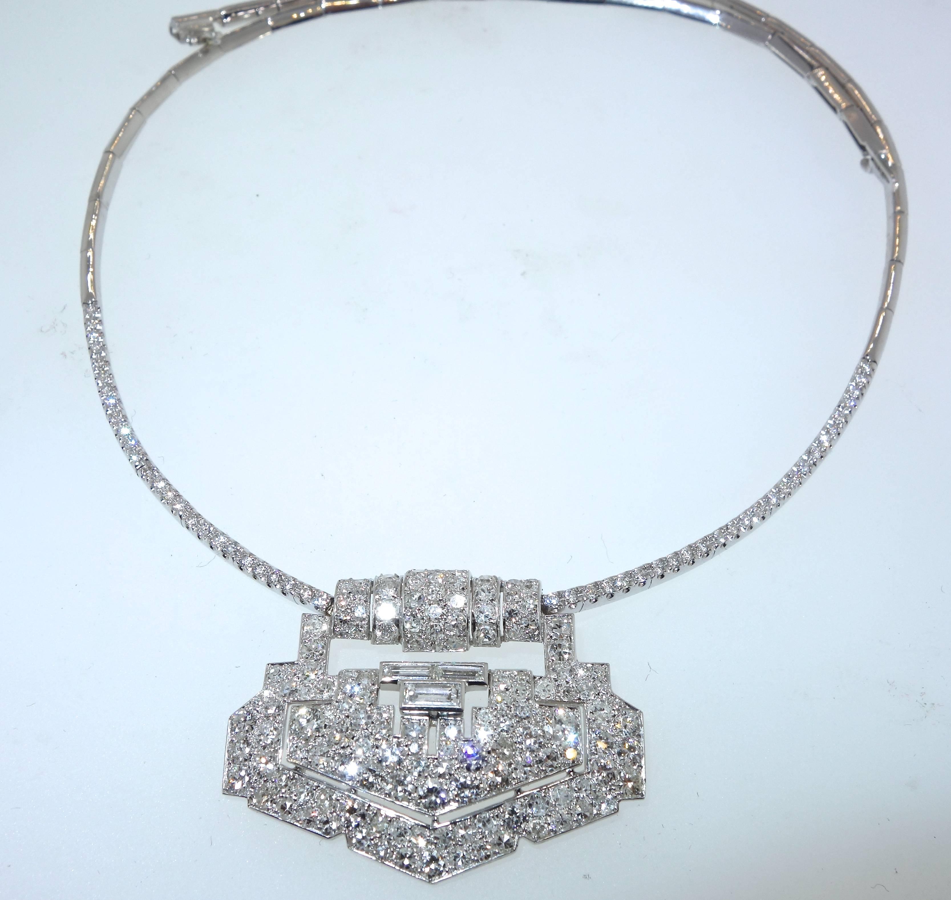 The clip is Art Deco, circa 1930, it has been recently altered so that it suspends from an 18K white gold diamond necklet.  The work was done well and the necklace is quite dramatic and a gorgeous way to wear a clip. There are approx, imately 5.1