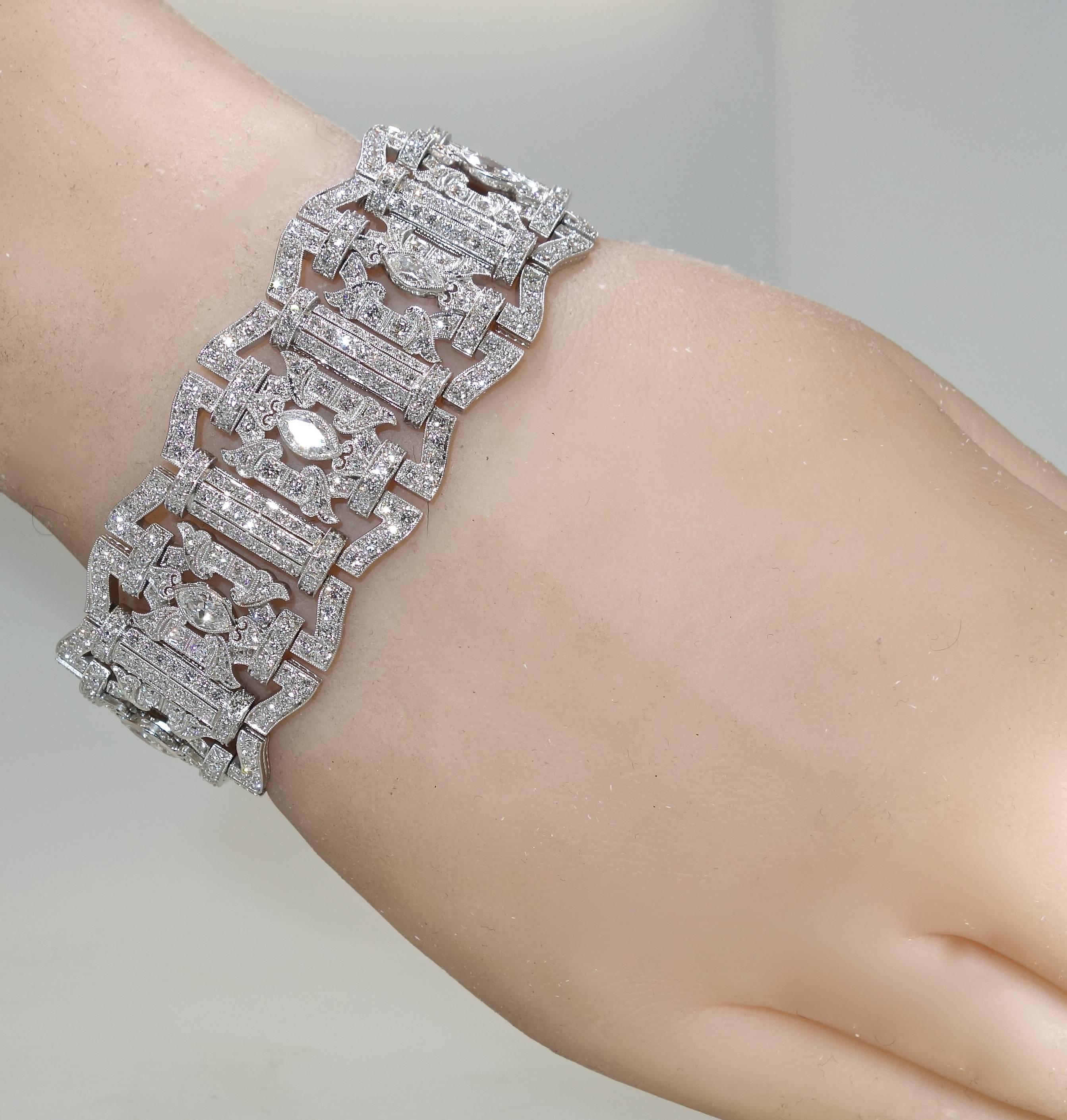 The platinum work is superb.  See the engraving on the sides and the clasp.  The back of the bracelet is well azured out a hallmark of wonderful workmanship.  The 15 cts. of diamonds are all near colorless (H) and very slightly included.  The