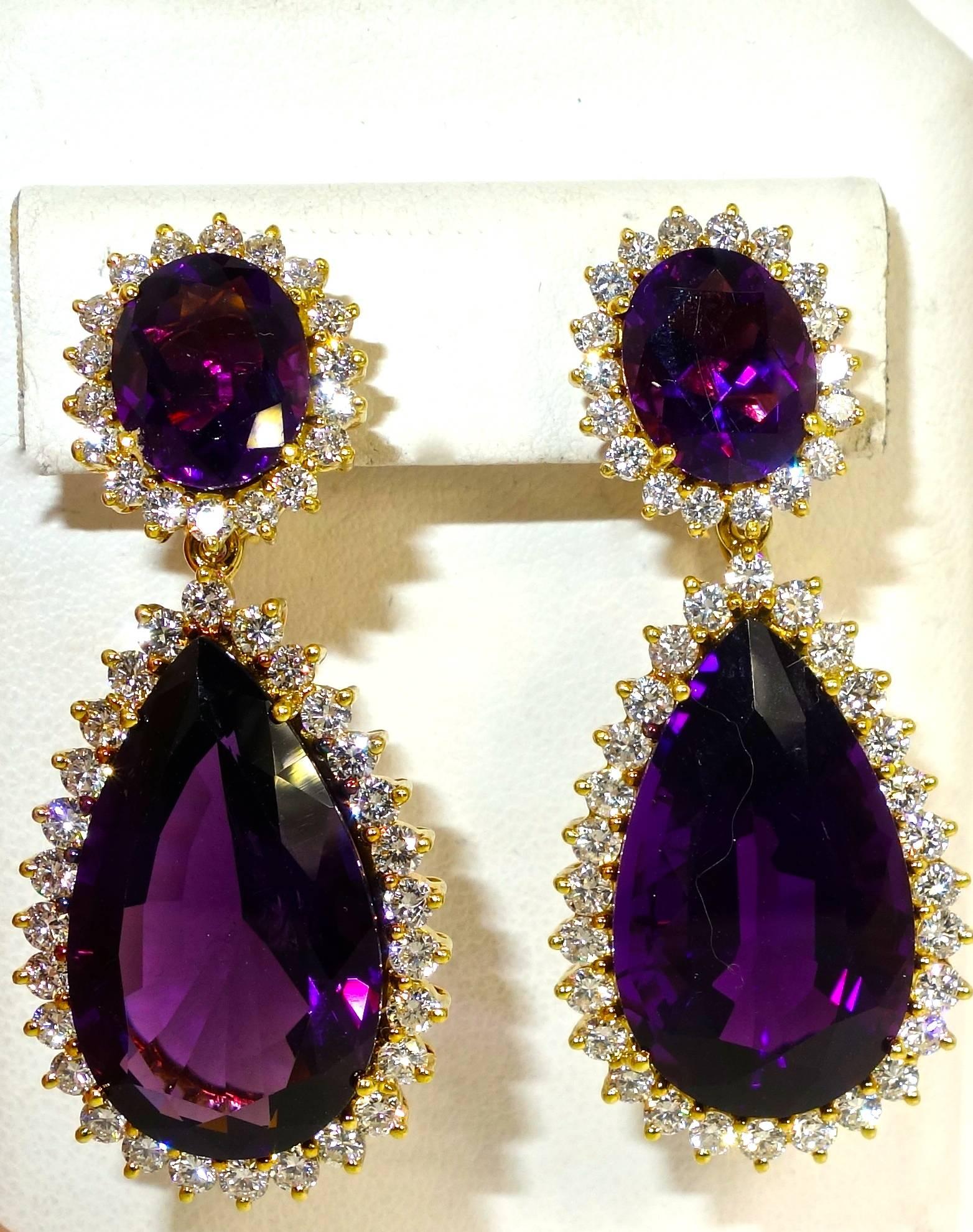 Fine deep purple amethysts - well matched, and weighing approximately 30 cts., accented with approximately 2.75 cts of white brilliant cut diamonds.  Marked 750 European mark for 18K.  Just over 1.5 inches long.  The bottom pear cut drops can be