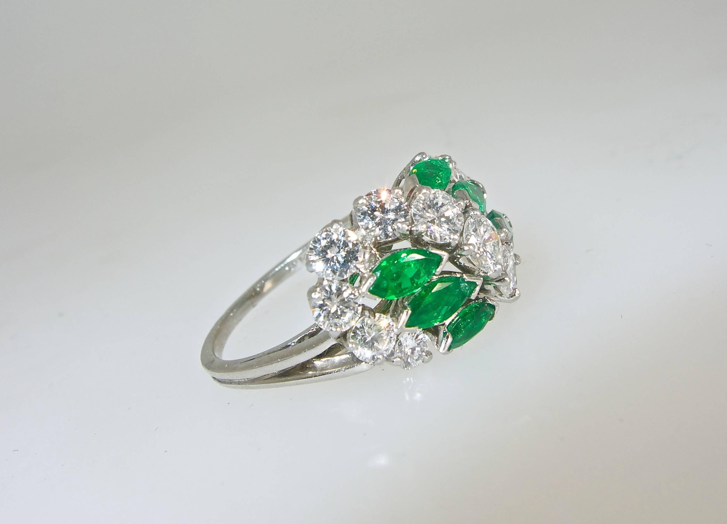 Signed and numbered by the world famous House of Cartier, this ring possesses 1.75 cts. of fine white diamonds and .70 cts. of bright green emeralds.  The ringis now a size 6.5 and can easily be sized.