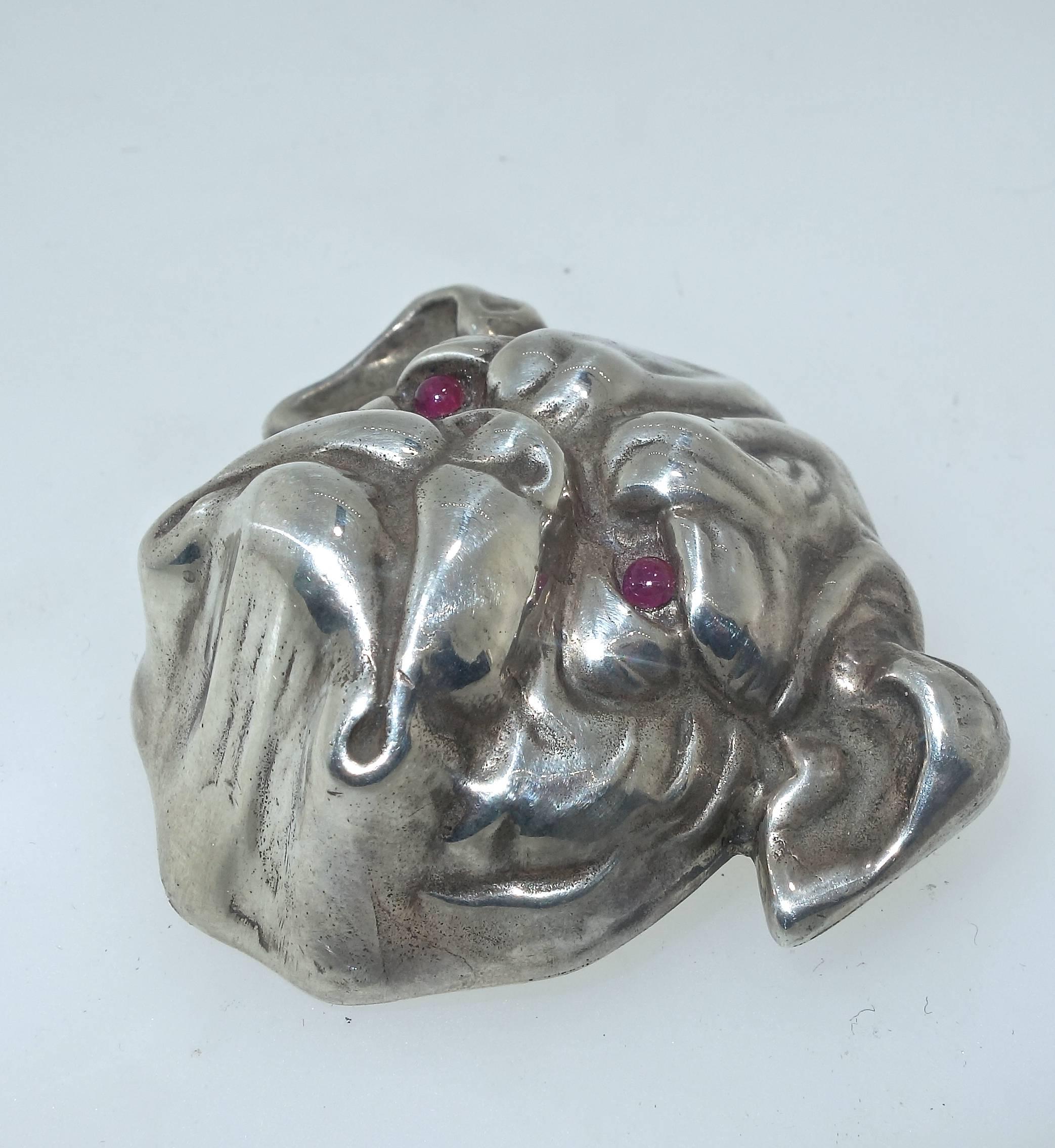 With small ruby eyes, Mr. Bulldog has a wonderful three dimensional quality,  he is 2 inches long, wish wonderful detail and slight wear which can be seen in our photos which are magnified.  Also the pin stem  catch has been replaced at sometime in