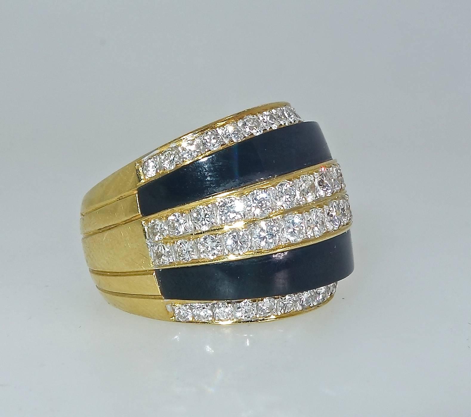 Fine white diamonds - brilliant cut, well matched, near colorless and very slightly included (H/VS) these 60 diamonds weigh approximately 2.35 cts.  Bands of onyx accent the white diamonds creating a bold and striking color contrast.  This ring is a