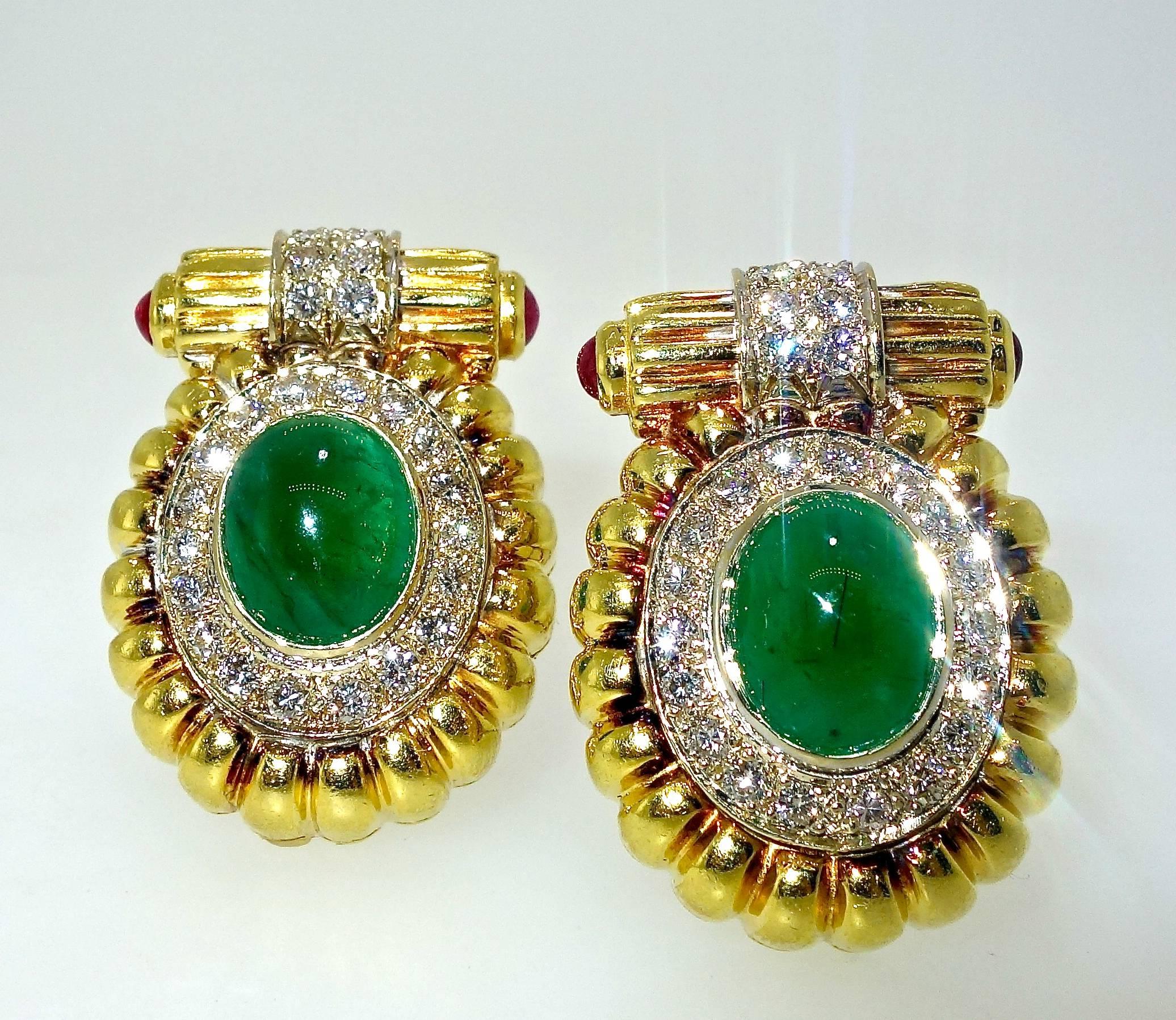 The 2 well matched cabachon emeralds are a deep green.  They weigh a total of approximately 7 cts.  Surrounding these center stones are 36 diamonds all well matched, brilliant cut stones, weighing a total of approximately 1.44 cts.  The diamonds are
