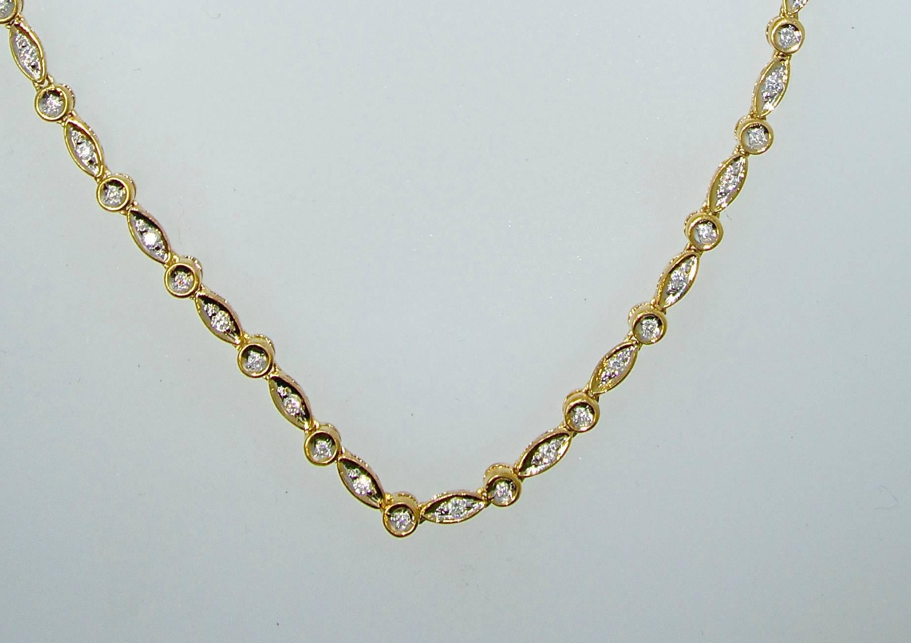 This is a gold necklace with 169 small fine brilliant cut diamonds.  There is approximately 4.2 cts.  These bead set diamonds are near colorless (I/J) and slightly included.  The length of this necklet is 19.5 inches by 1/8 inch.  It is marked 14K.