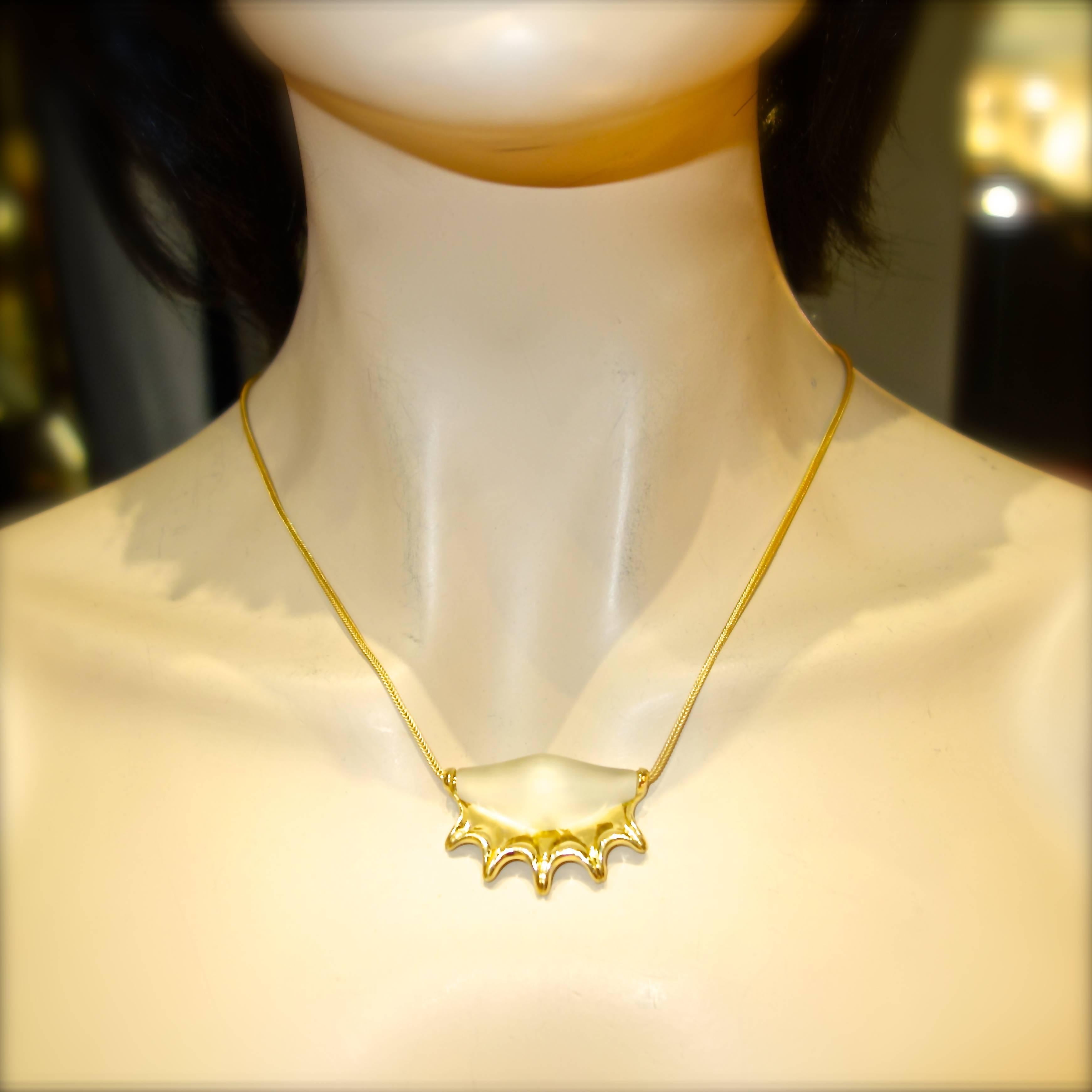 Ilias Lalaounis 18K gold necklace with a frosted rock crystal pendant, the rock crystal weighs approximately 10 cts., this designer piece is from the Athen's store and comes with the original receipt and pouch.  The foxtail chain is 15 inches long