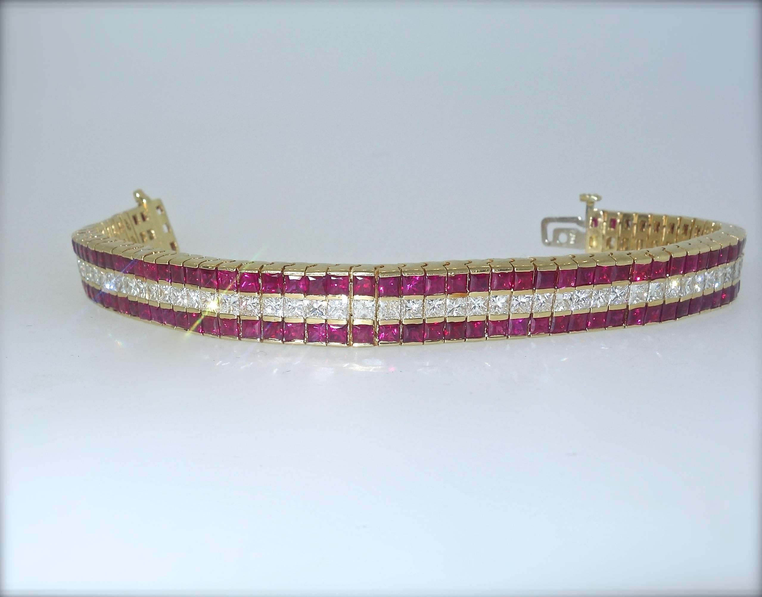 This flexible straight line bracelet possesses 66 fine white diamonds and 132 bright red rubies.  There are approximately 10 cts of diamonds and 20 cts of rubies.  The yellow gold piece weighs 27.5 grams.  It is 6 7/8 inches long and 3/8 inches in