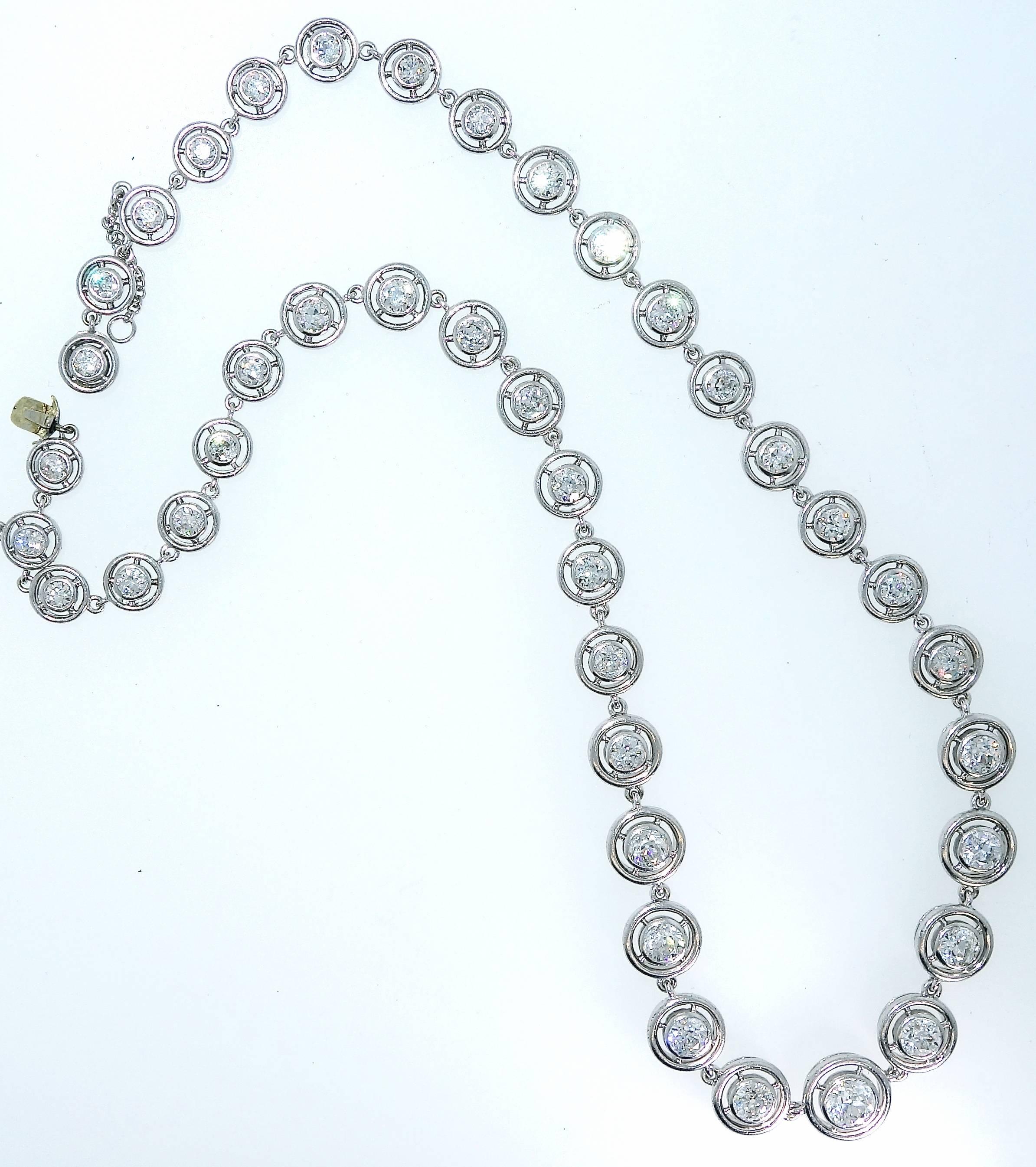 Platinum necklace centering European cut diamonds, bezel set.  The slightly graduating 40 diamonds  are all well matched, H/I color (near colorless), slightly included to very slightly included (VS-SI1).  There are approximately 8.5  cts. totally. 