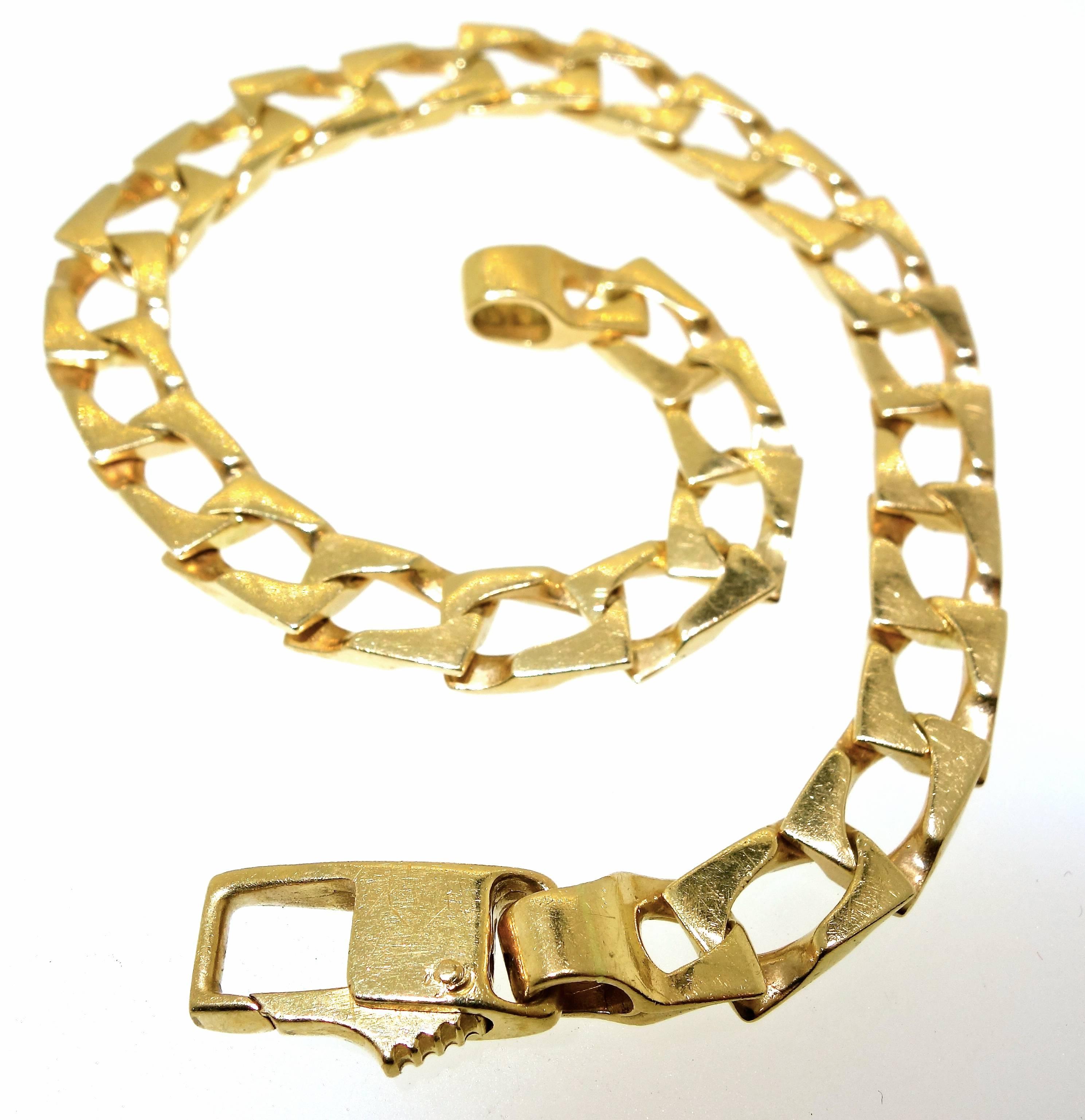 Nine inches in length and weighing 21.25 grams, this unusual link bracelet is great for a large wrist - either man or woman.  We are selling it close to its gold scrap value of $470.