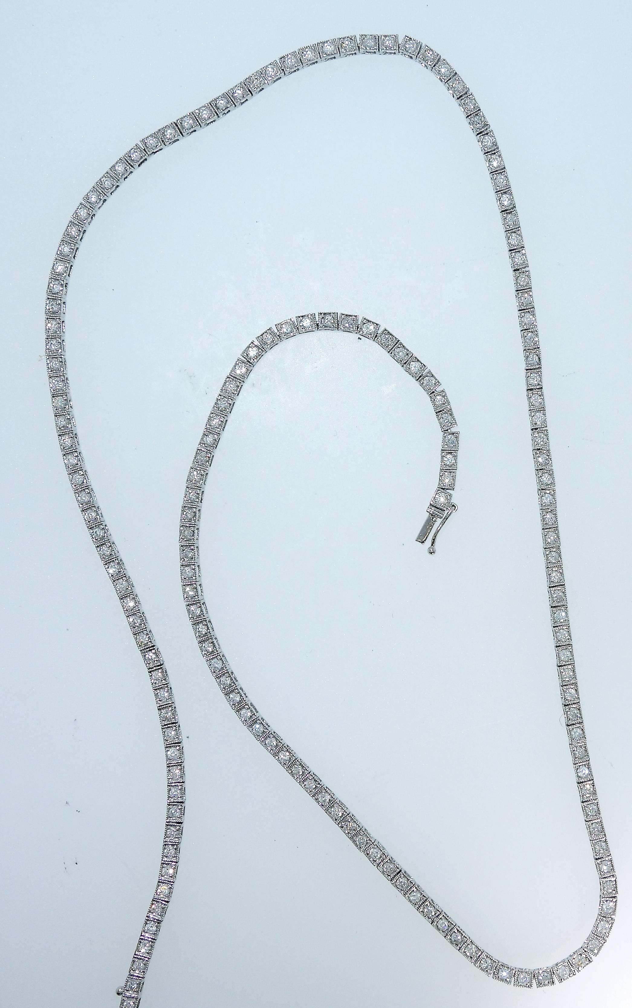 Diamond necklace which is very versatile because it is long, can accommodate a pendant, can be worn during an evening event and perfect for daytime also!  There are 170 full cut modern brilliant cut diamonds each set in a milgrained box of white