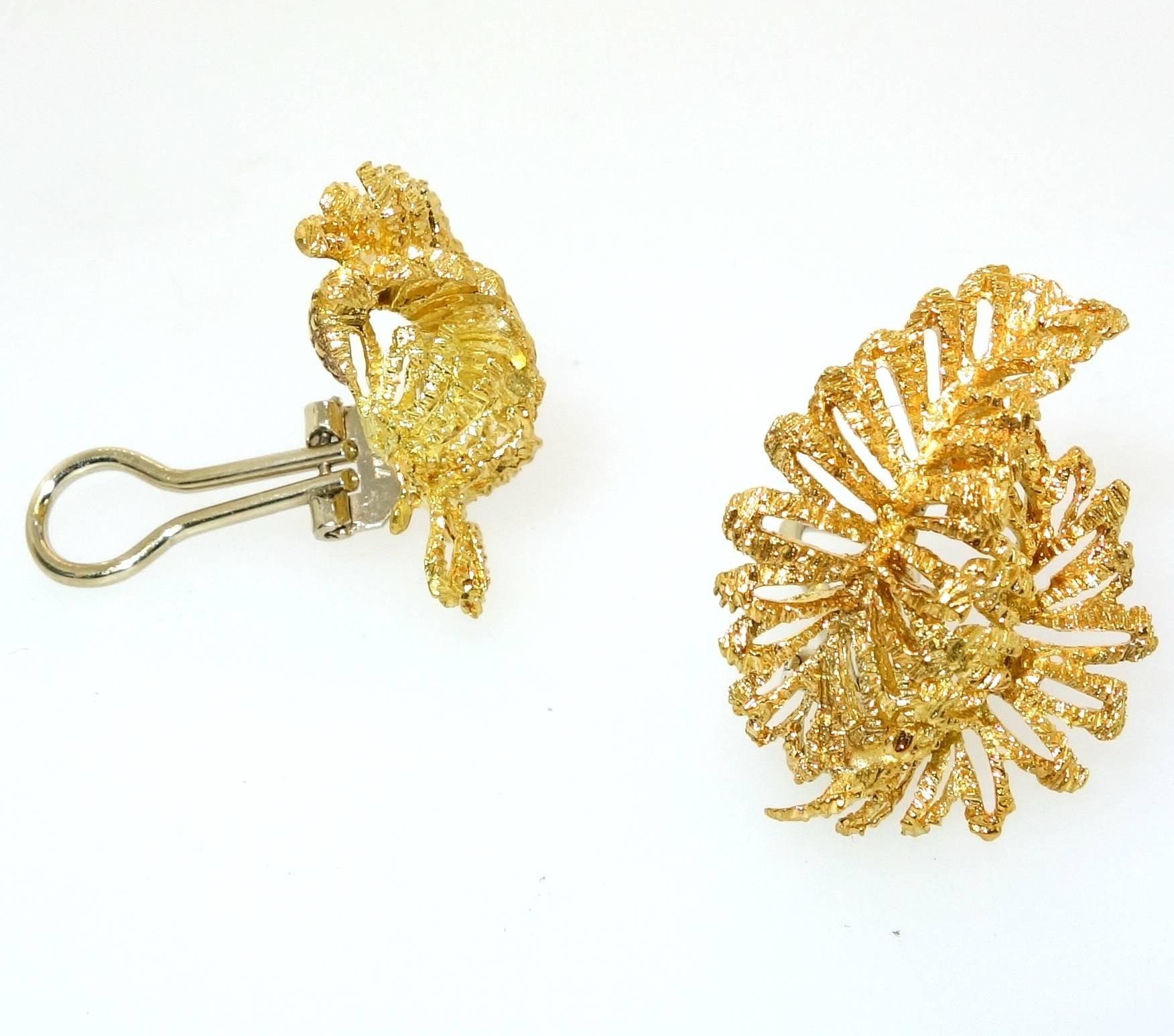Sweeping up the ear, these bright yellow gold earrings weigh 13.84 grams.  They are 18K, marked 750 and are just over one inch in length.