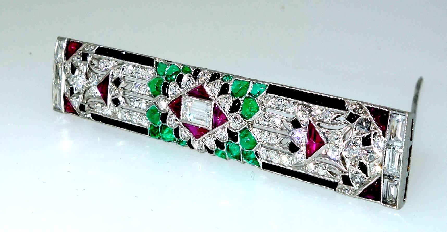 Art Deco Emerald, Diamond, Ruby and Onyx Brooch, circa 1925 In Excellent Condition In Aspen, CO