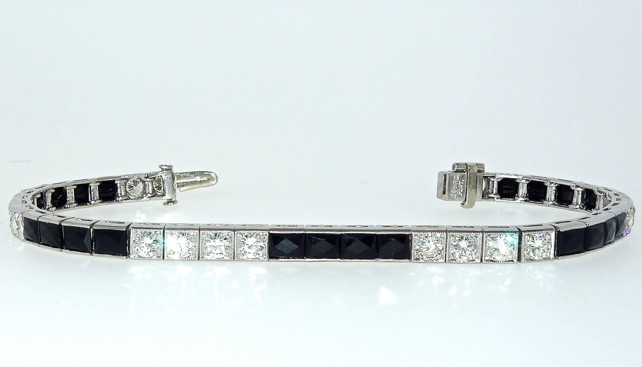 Platinum Art Deco bracelet with French cut onyx and 20 fine round diamonds.  Total diamond weight is approximately 3.25 cts.  This bracelet is just under 7.25 inches long