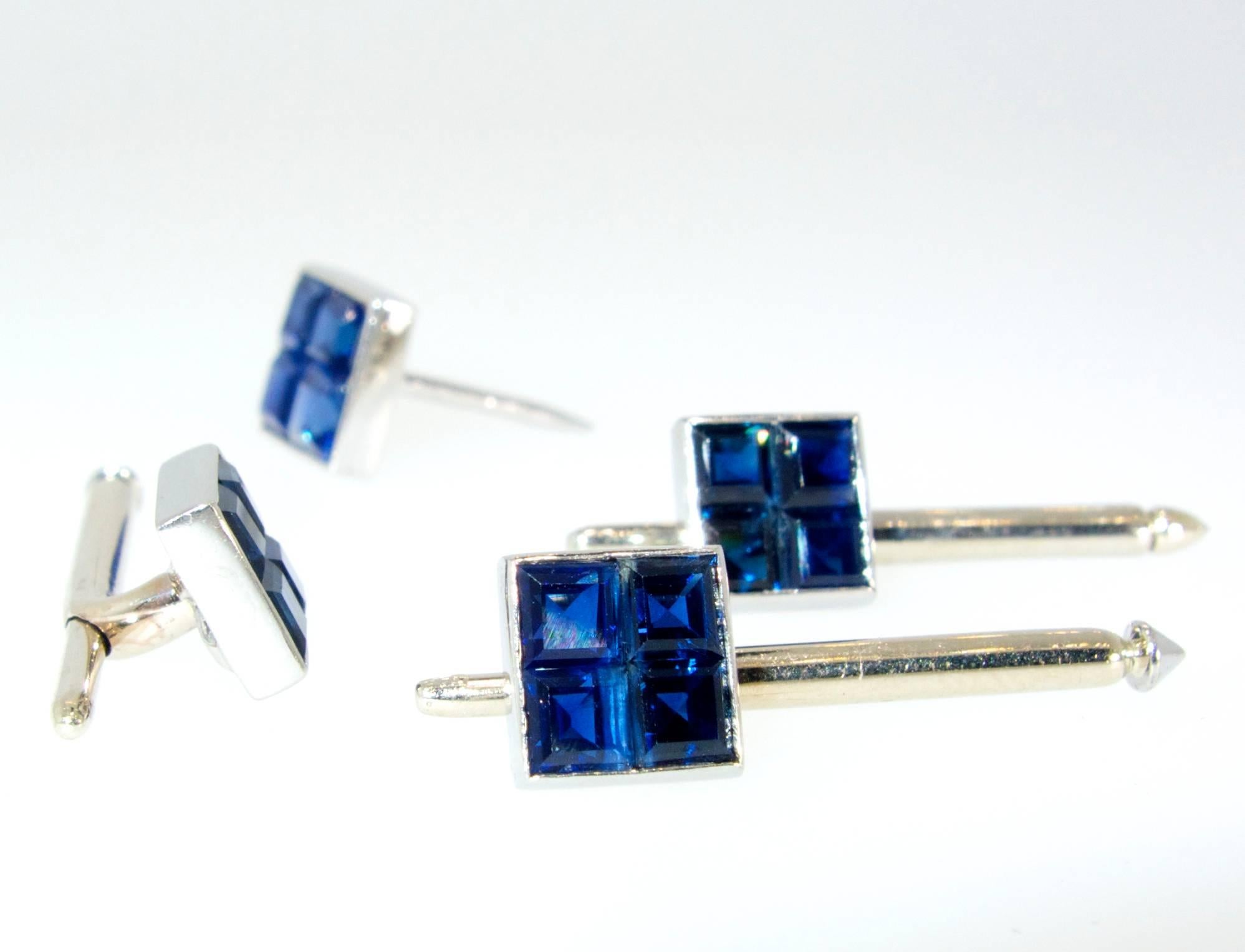 Fine natural unheated vivid blue sapphires are invisibly set in platinum.  There are three shirt studs and one tie pin/extra shirt stud.  Signed and numbered by Van Cleef & Arpels, NY.