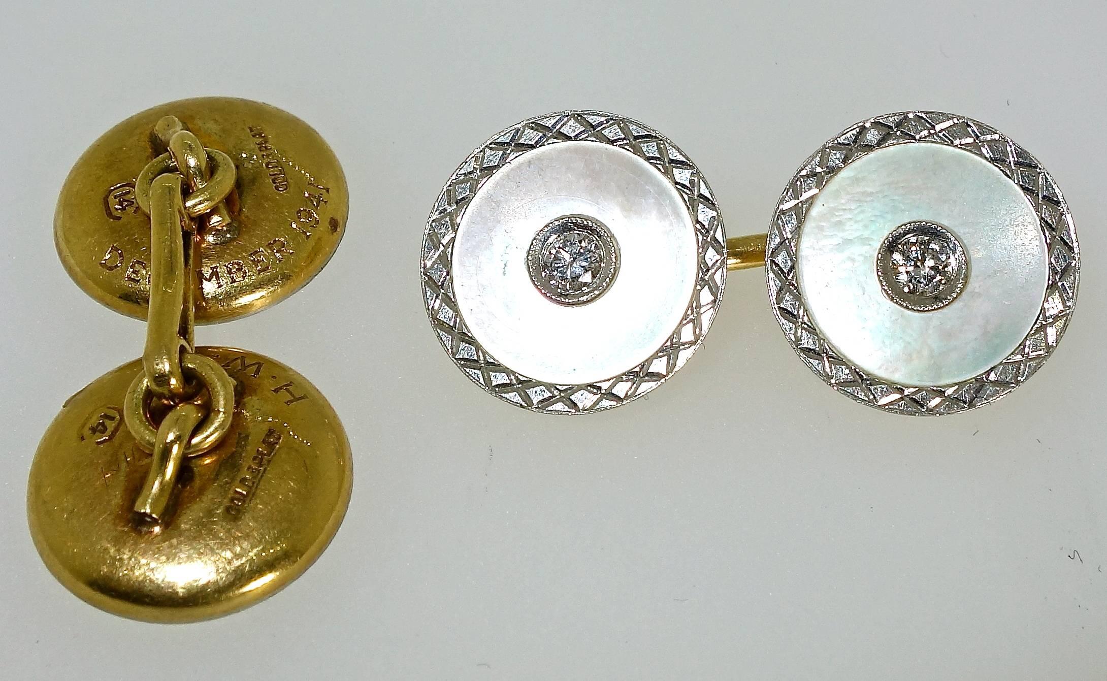 Vintage diamond cufflinks with engraved edges surrounding white mother of pearl  and a bead set diamond in the center and backed with gold.  There are .33 cts. total weight of the white European cut diamonds.  Early Art Deco.