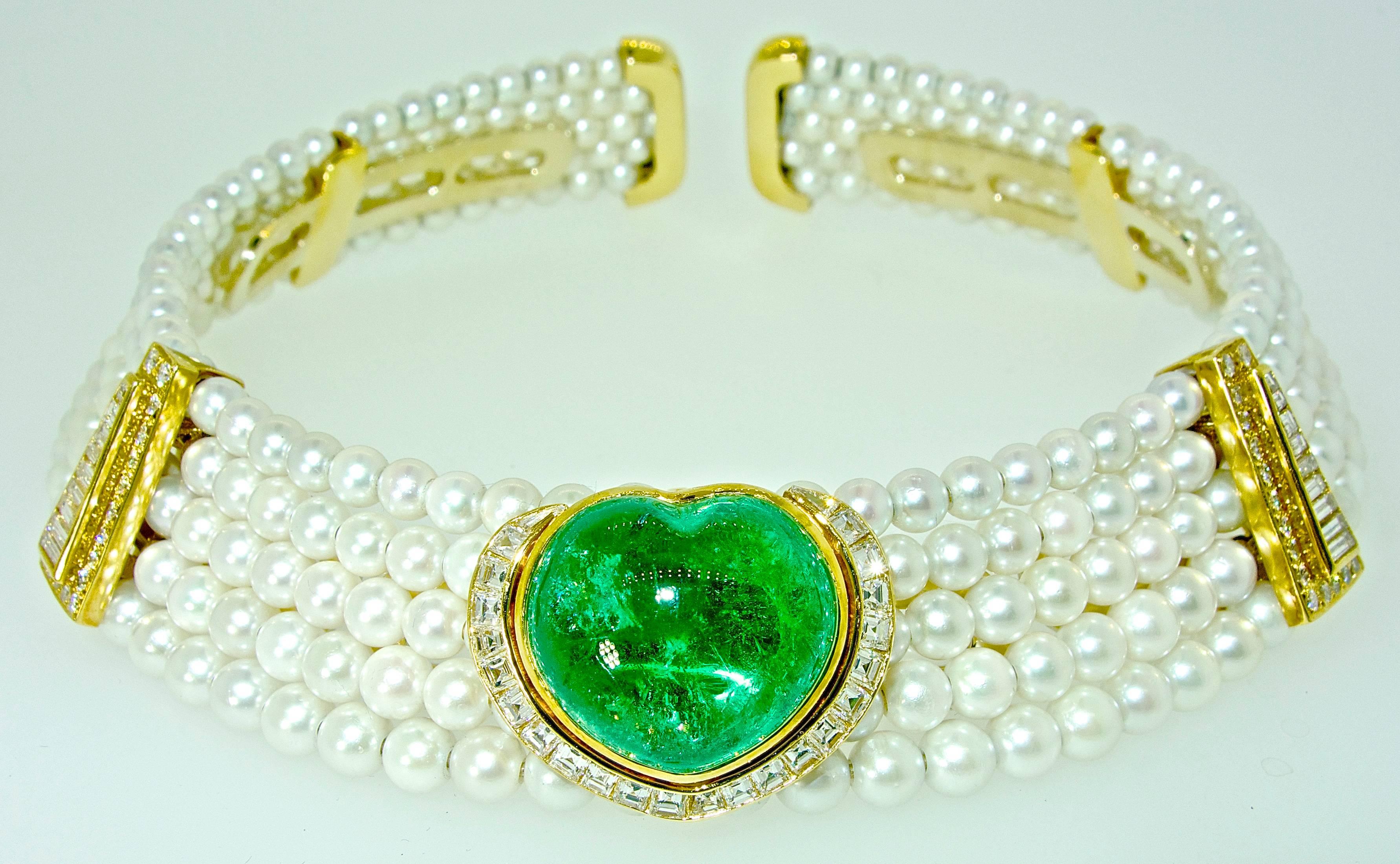 In the style and workmanship, of the great designer Marina B. (but not signed), this striking necklace centers an important fine natural emerald weighs approximately 25+ cts.   This natural large emerald is probably Colombian and displays a pleasing