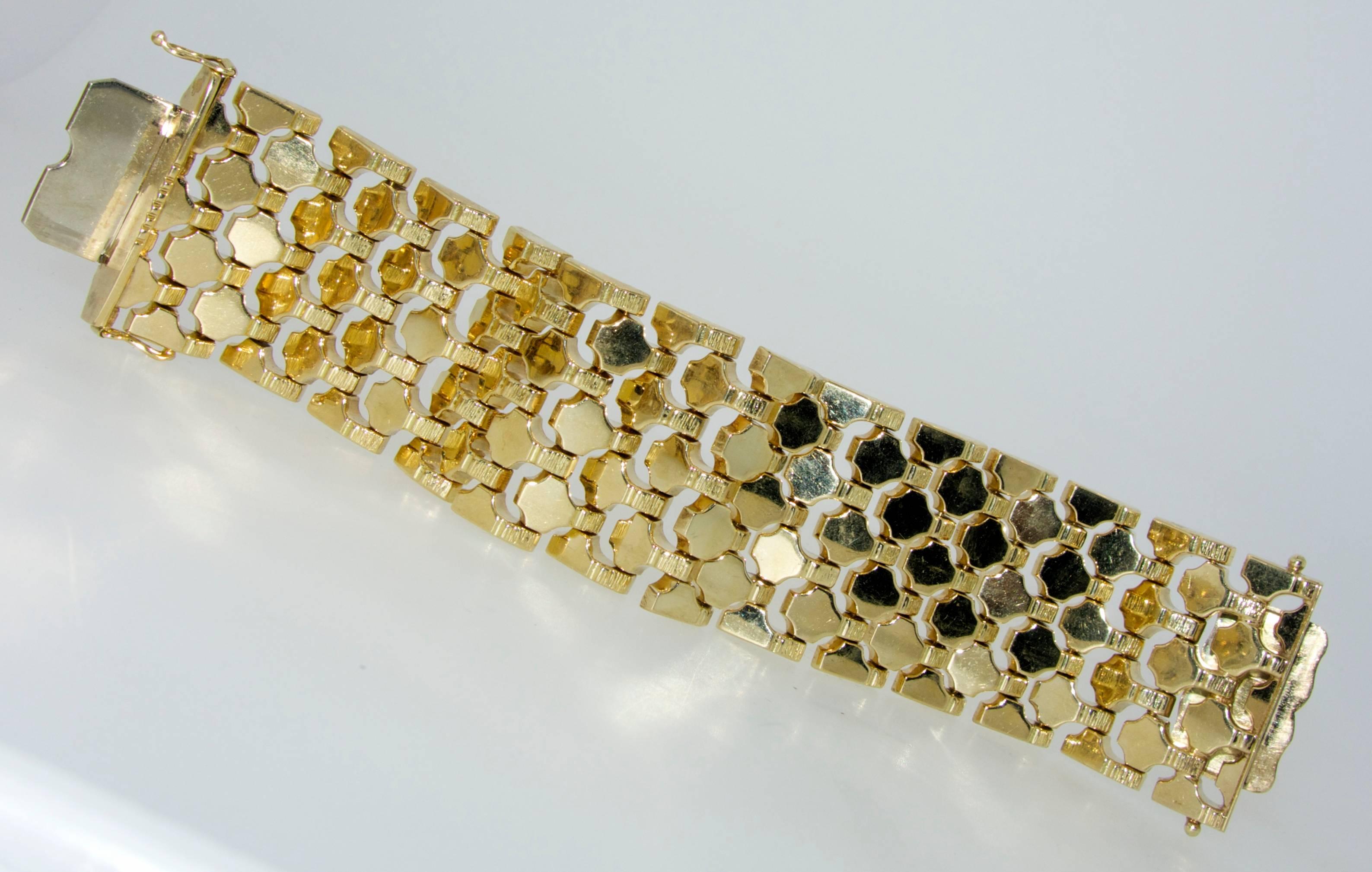 
The wide highly flexible polished gold bracelet can be worn separately or  can be seamlessly connectedwith the matching gold belt.  The bracelet and belt combined have a length of 33 inches. The bracelet is 6.5 inches long alone and the belt 