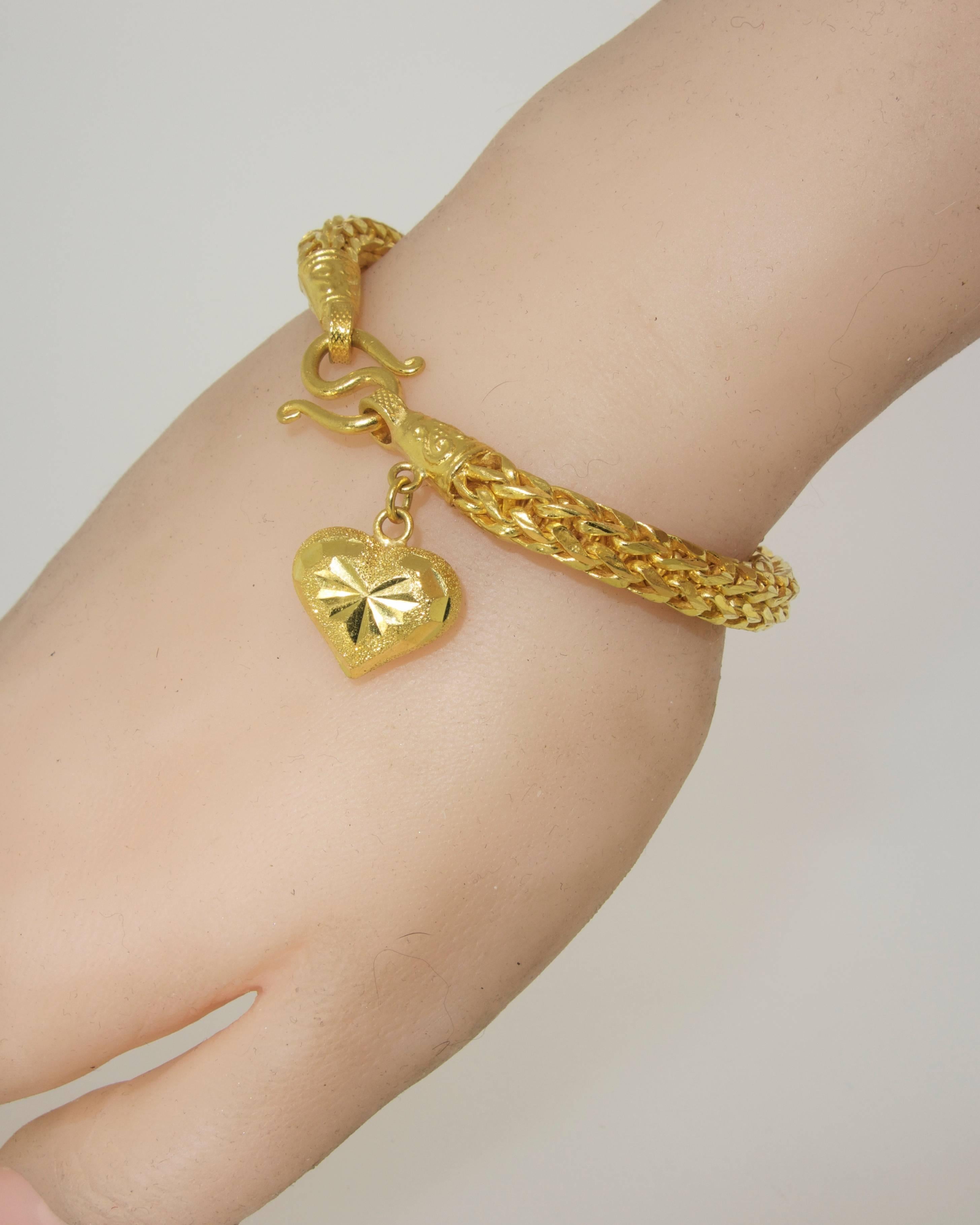 Contemporary Gold Braided Bracelet with Heart Shaped Charm