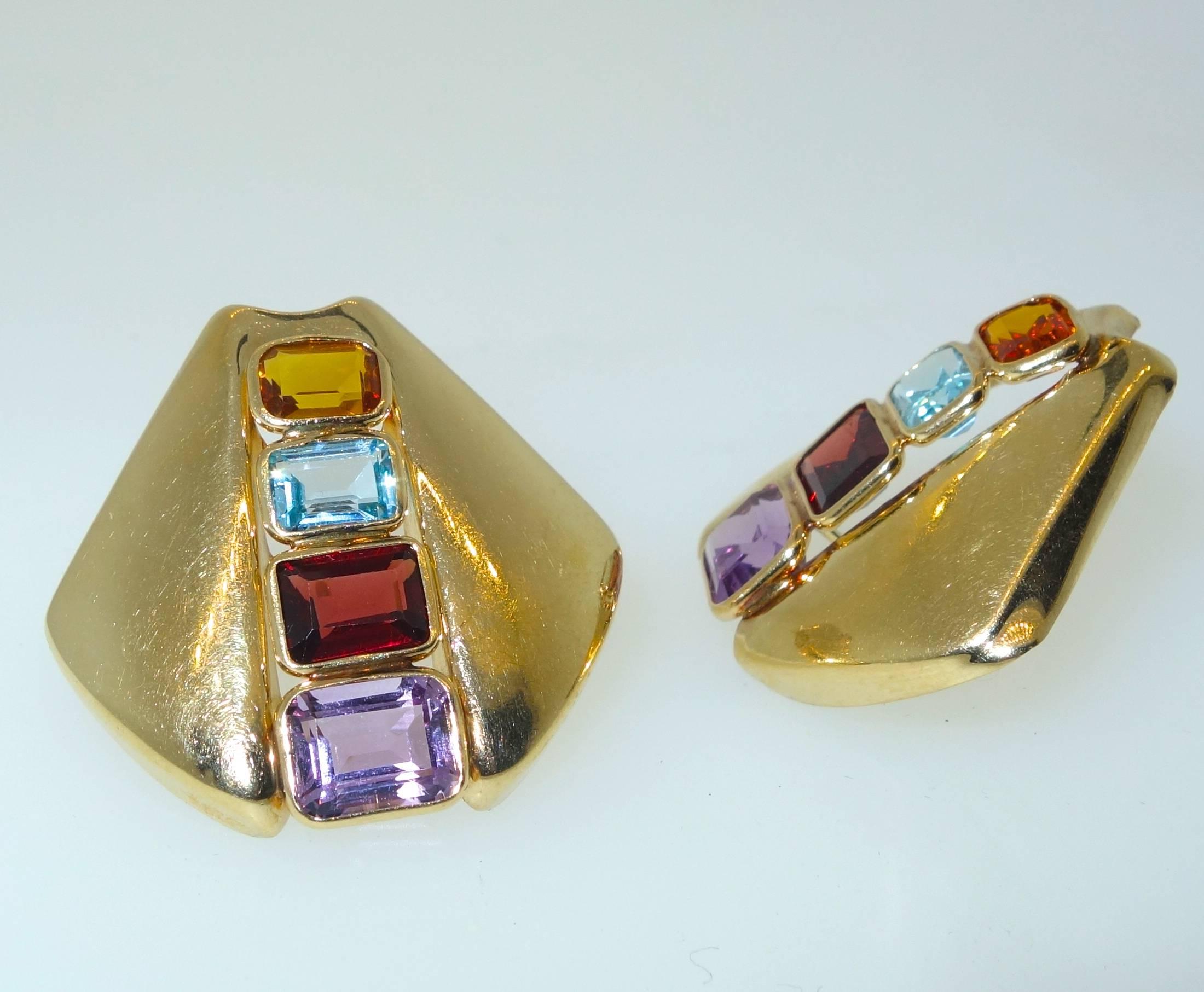 Bright stones - Citrine, garnet, amethyst and blue topaz are bezel set into gold shields  to create a colorful statement for the ear.  These earrings are pierced and can be converted.  They measure 1.25 inches and weigh 6.94 grams.
