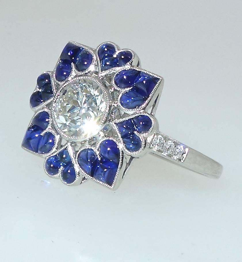 Contemporary Platinum, Diamond and Sapphire Ring