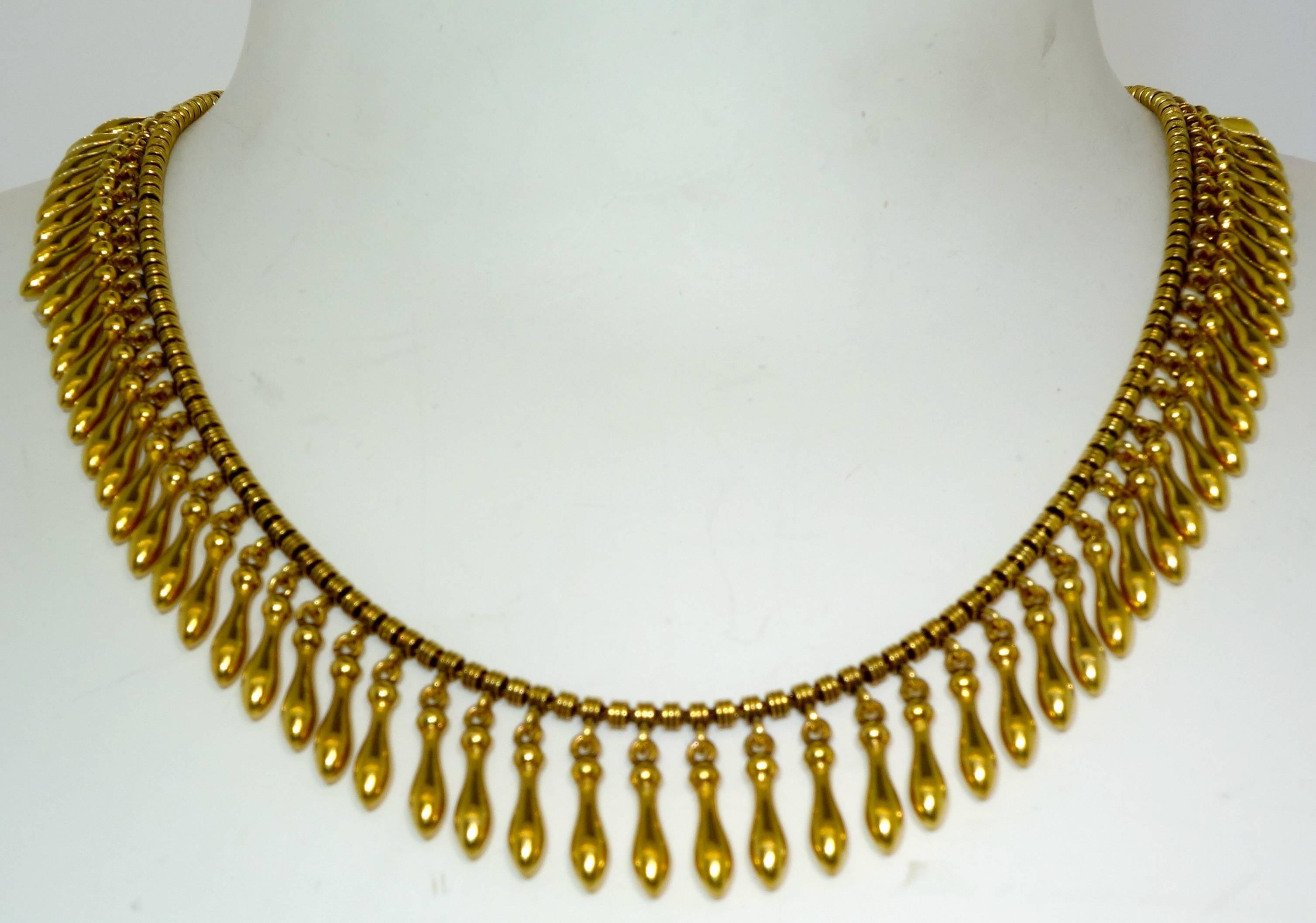 18K gold classic late 19th century necklace.  14 inches in length, worn at the neckline.  This piece is easy to wear and very distinctive.  Notice how well this solid but delicate necklace has been made - the workmanship is very fine, it terminates