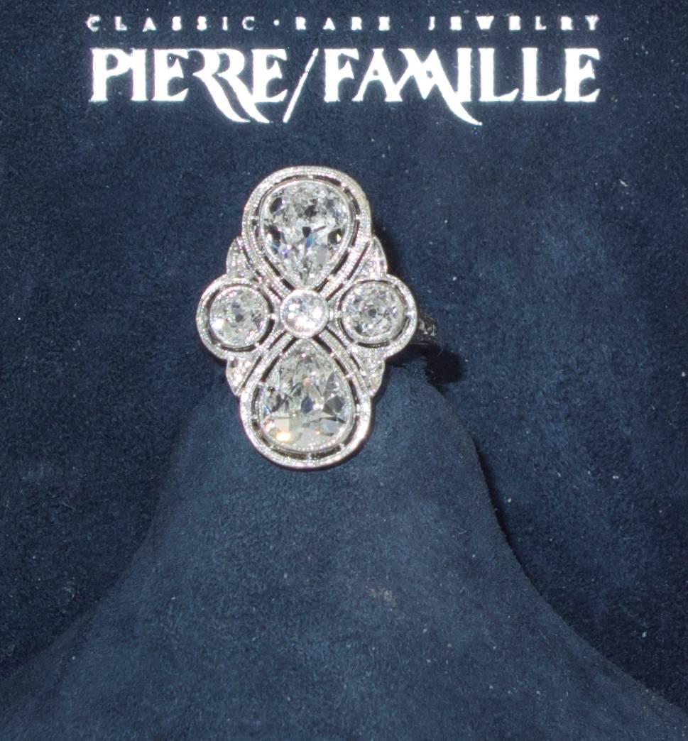 Important diamond, Edwardian, well made platinum ring possessing old pear cut diamonds and European cut diamonds totaling approximately 3.20 cts.  These diamonds are all white (H) and very slightly included. 
This ring is a particularly fine example