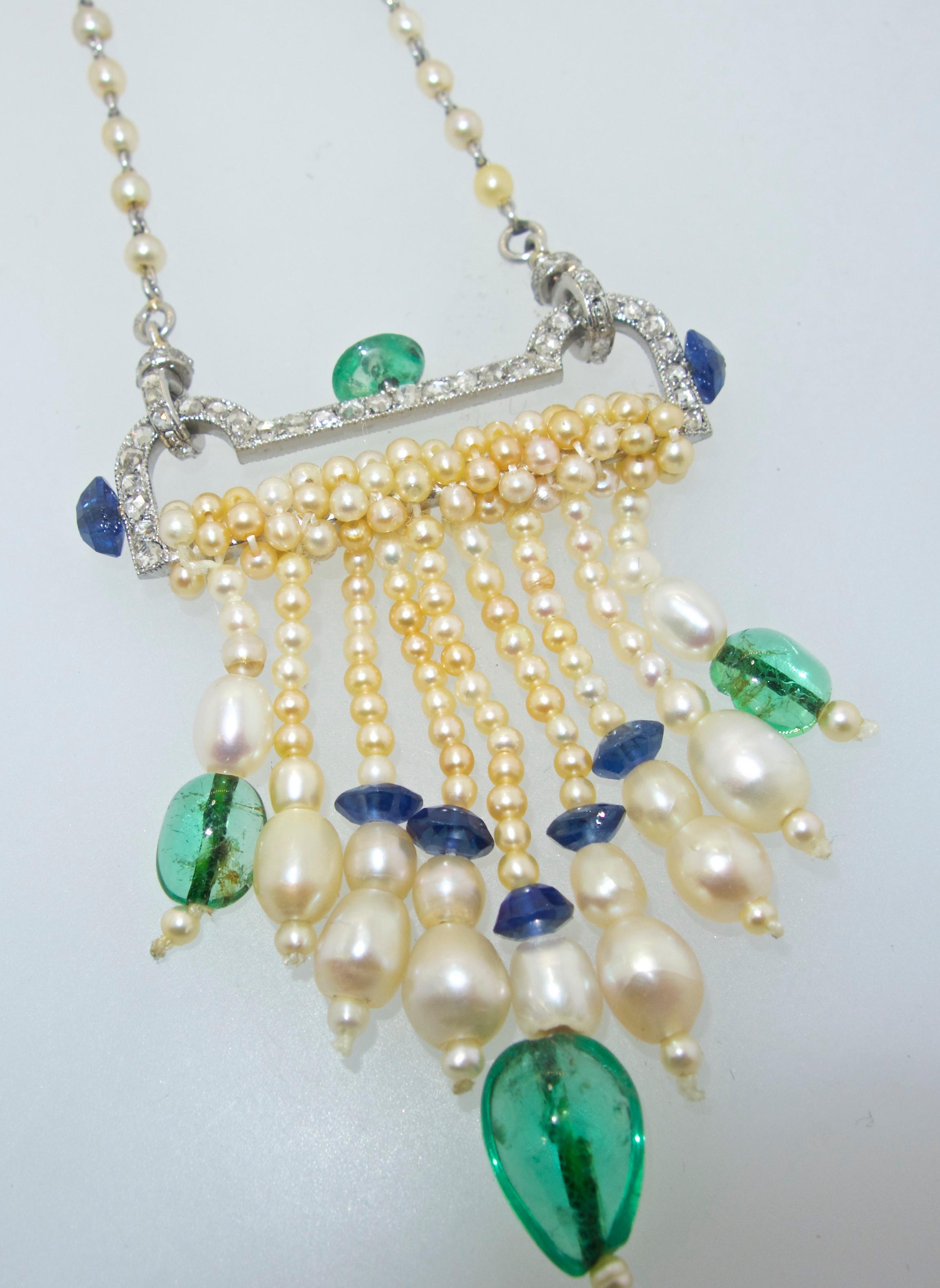 French Art Deco  25.5 inches long with French hallmarks on the natural pearl and rose cut diamond chain which suspends the Art Deco pendant which is composed of rose cut diamonds, sapphires and emeralds.  The pendant is 2.5 inches long and can be