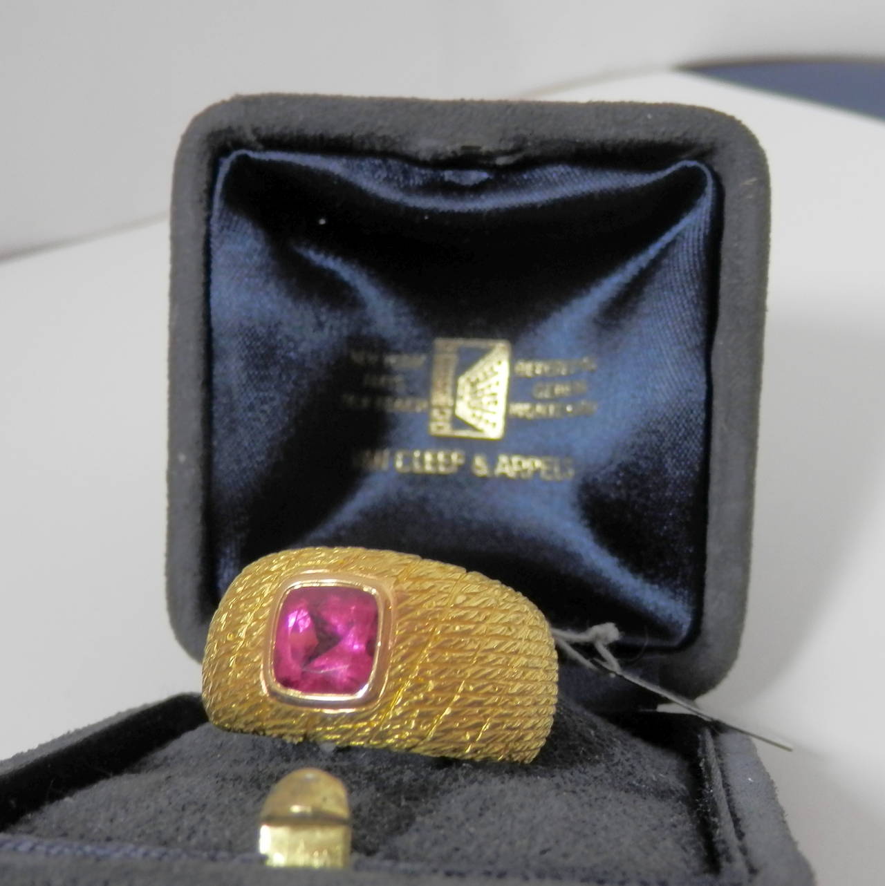 18K yellow gold holding a fine bright pink tourmaline, signed VC&A France, and numbered 5K 902-3, bearing French hallmarks. Can be sized, now a 6.