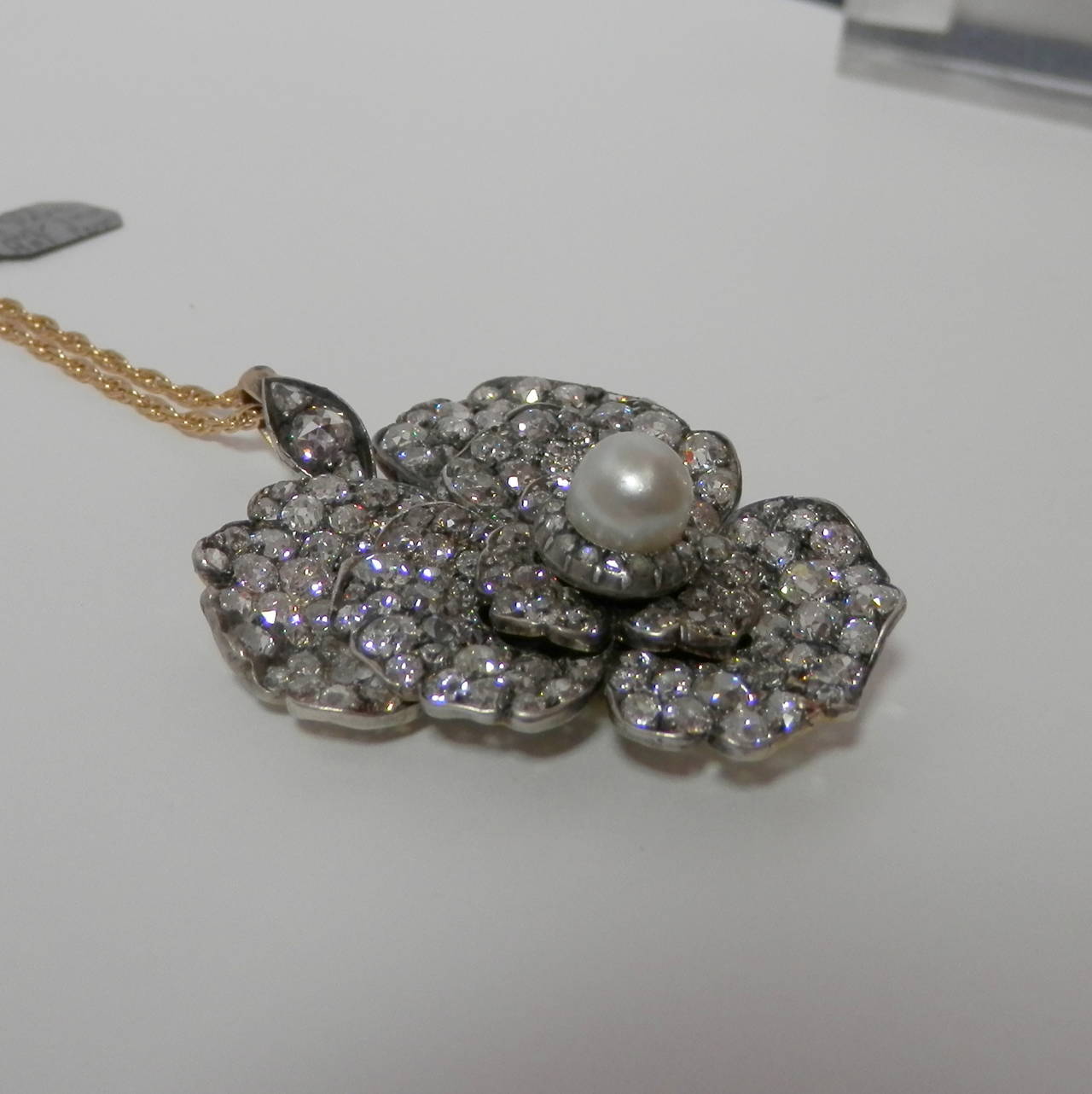 Antique natural pearl and diamond pendant, pearl is 7.5 mm and there are 8.7 cts. of diamonds.
