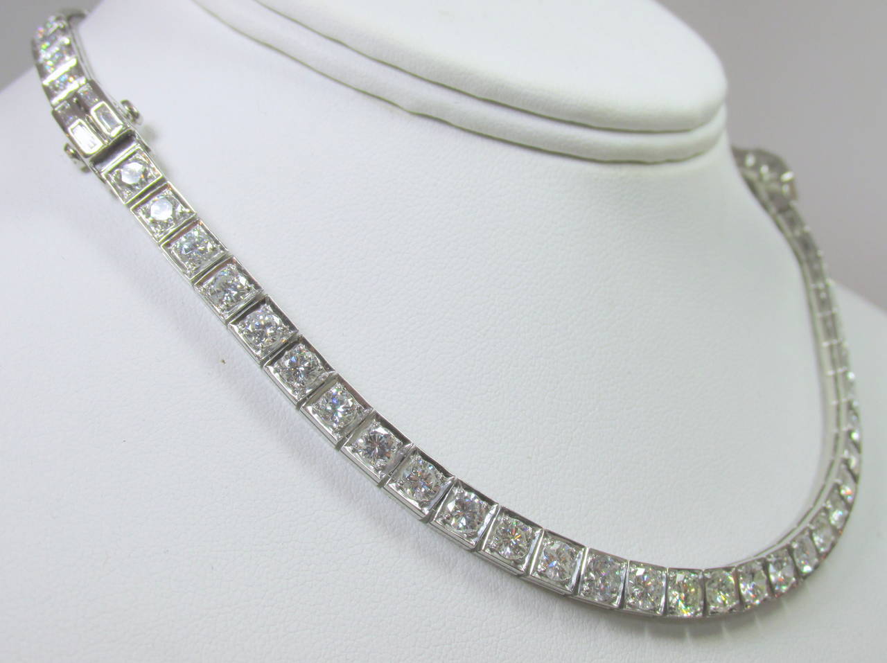 Platinum and diamond necklace with added piece to make longer in back.  Separates into two bracelets.  Diamonds are approximately near colorless (I)  and SI (slightly included) in clarity.  There are 72 rounds and 8 baguette cut diamonds.  The total