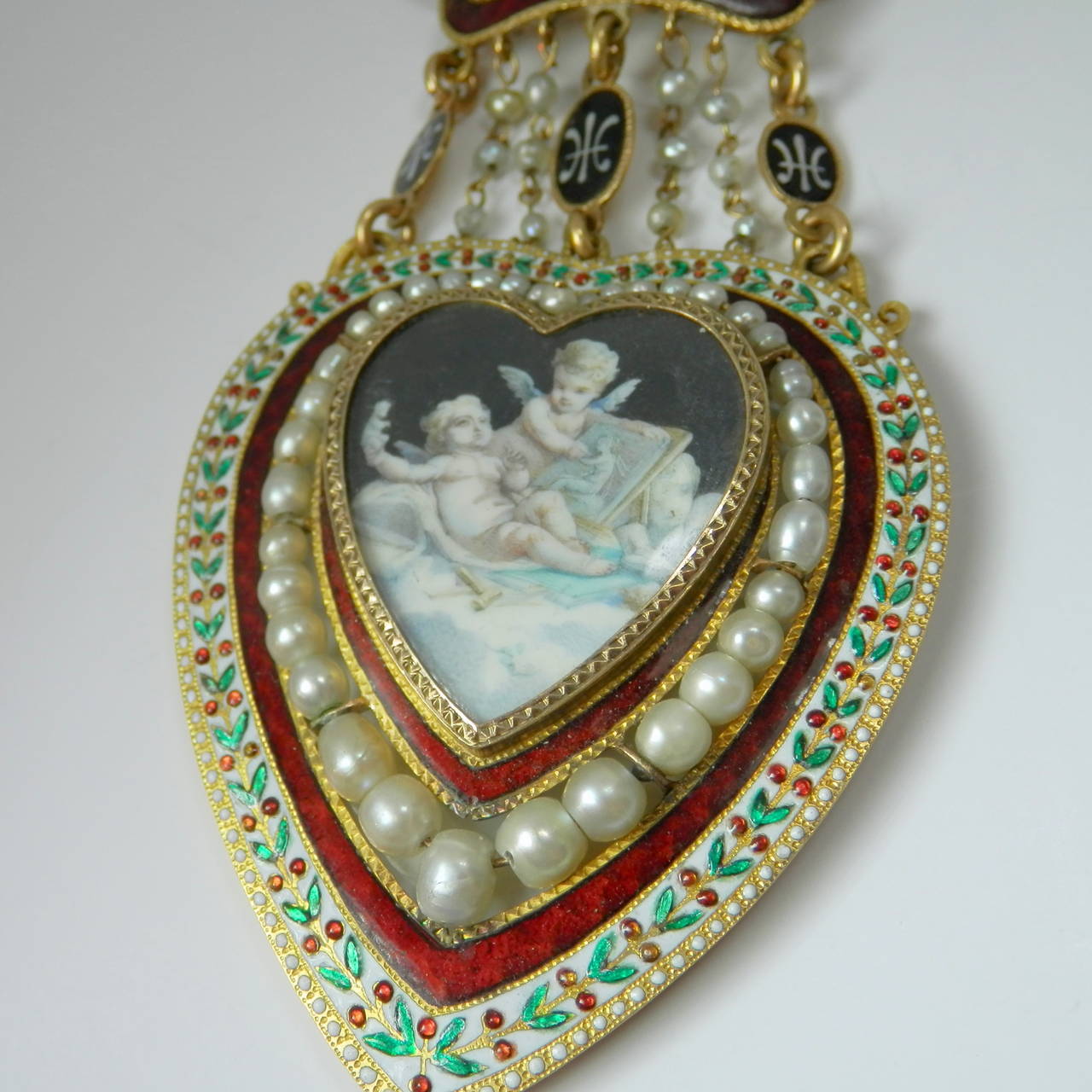 18K yellow gold, fine and unusual enamel and natural pearls describe this wonderful antique necklace.