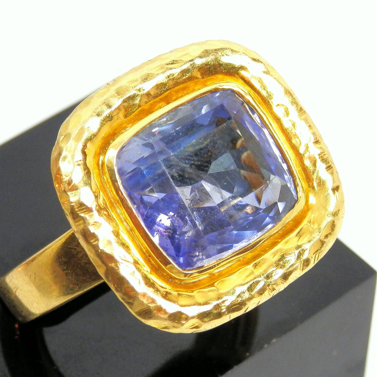 18K hammered finished rectangular cushion cut sapphire weighing 9.62 cts., Ceylon, no heat, clean, VS+ clarity ring which has a butterfly that is stamped both 18K and 750.  The stone measures 13.8 mm by 12.25 mm by 6.6 mm deep.  The sapphire is an
