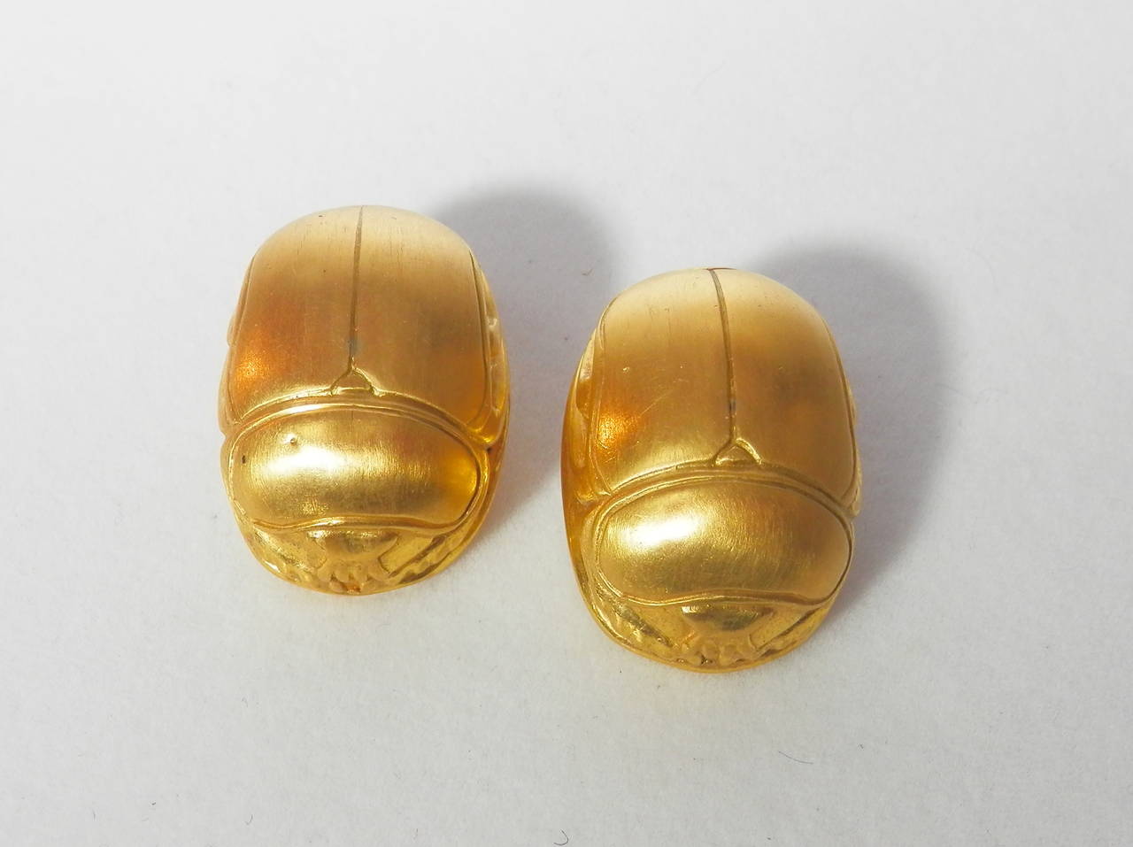 22K yellow gold large scarab motif on the ear earrings by Julius Cohen.  Circa 1960.