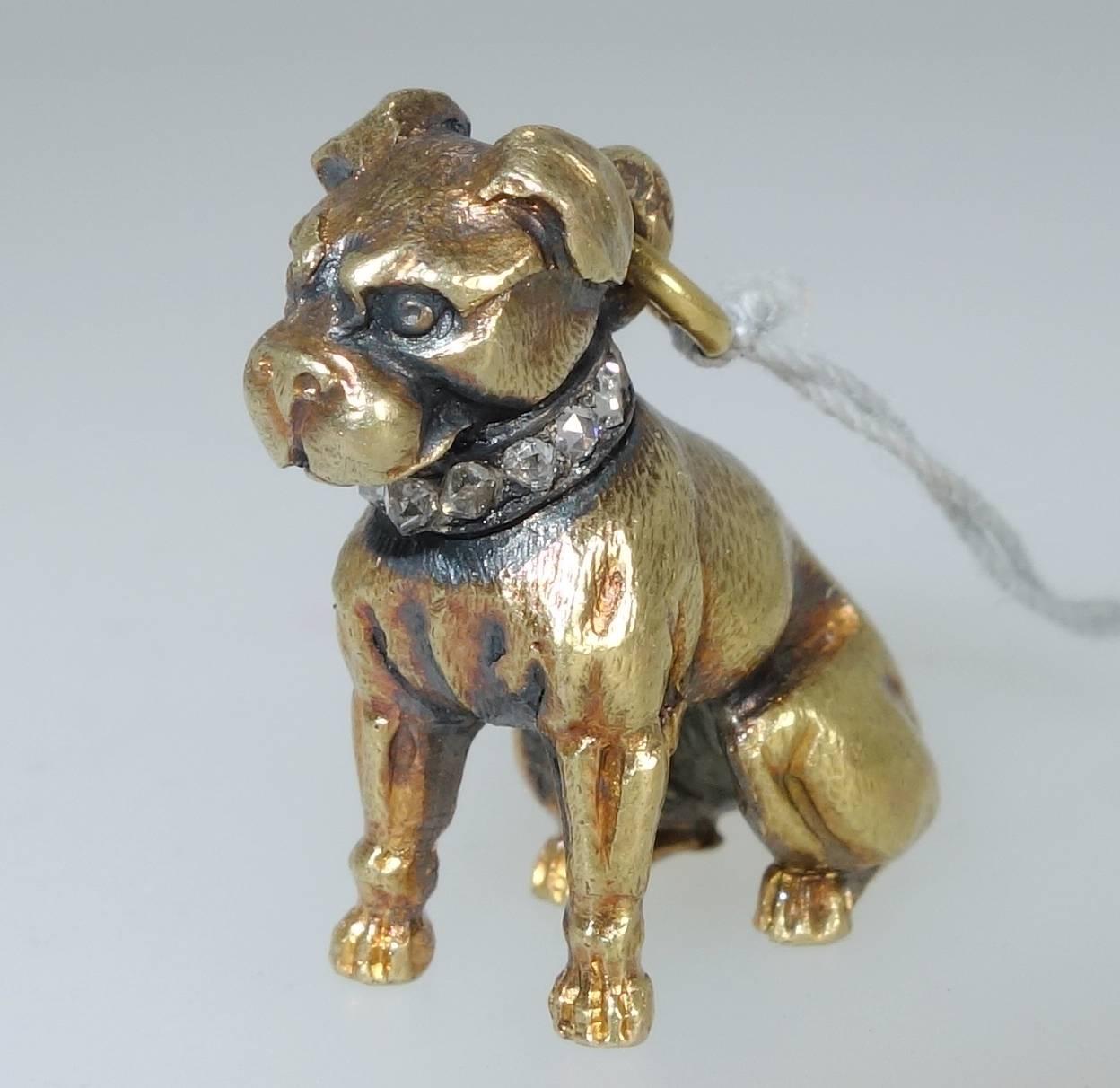 18K and three dimensional doggy is wearing a rose diamond collar set in silver.  This doggy is well defined and about an inch in length.  Note:  the chain is not included.  A 14K chain can be provided for an additional $100.00