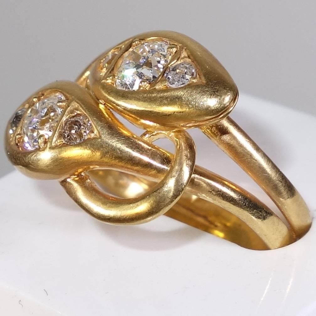 With 1 ct. of old cut diamonds, this is a fine example of a 19th century snake  ring.   This ring can be sized easily. 
