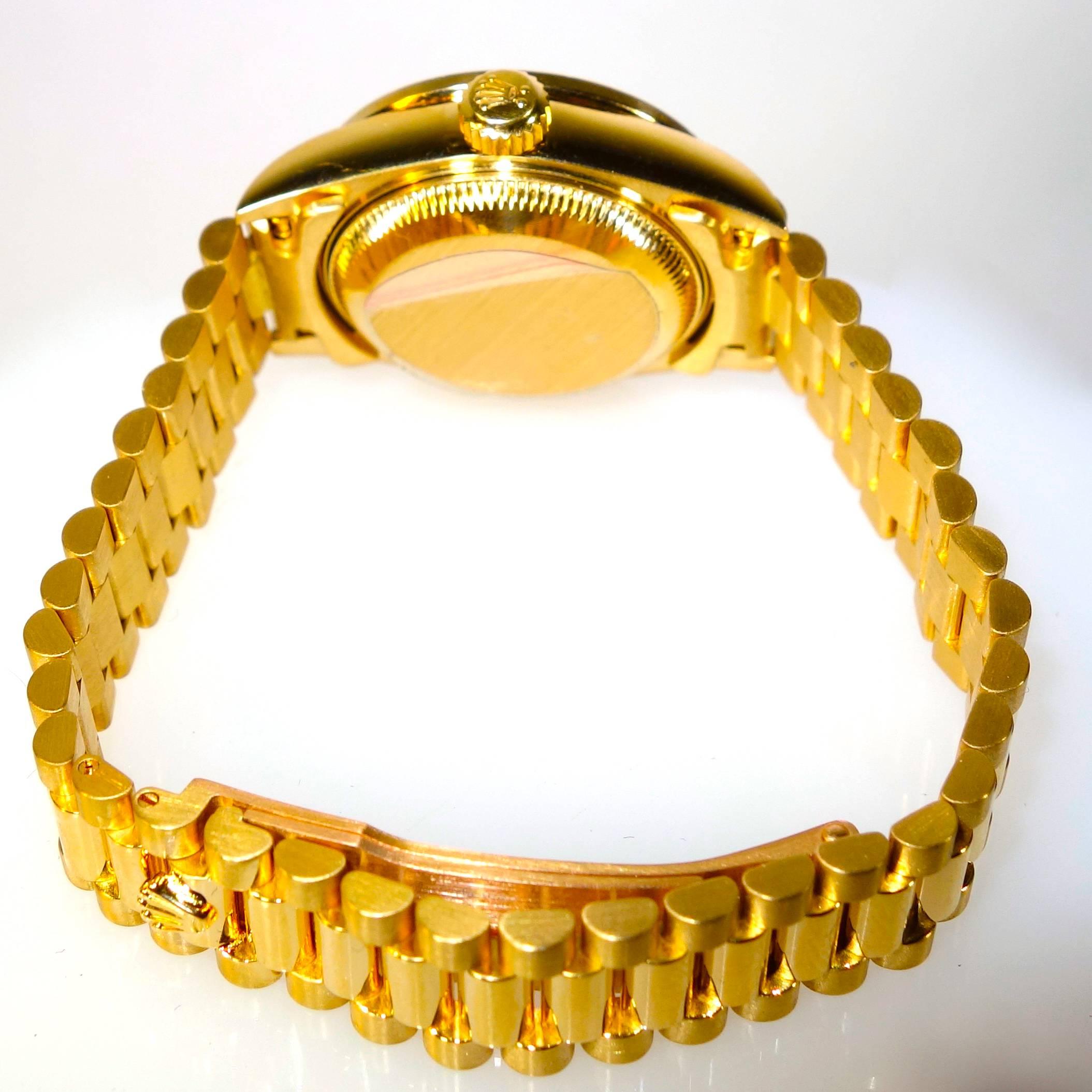 Rolex Lady's Yellow Gold Mother-of-Pearl Diamond President Automatic Wristwatch In Excellent Condition In Aspen, CO