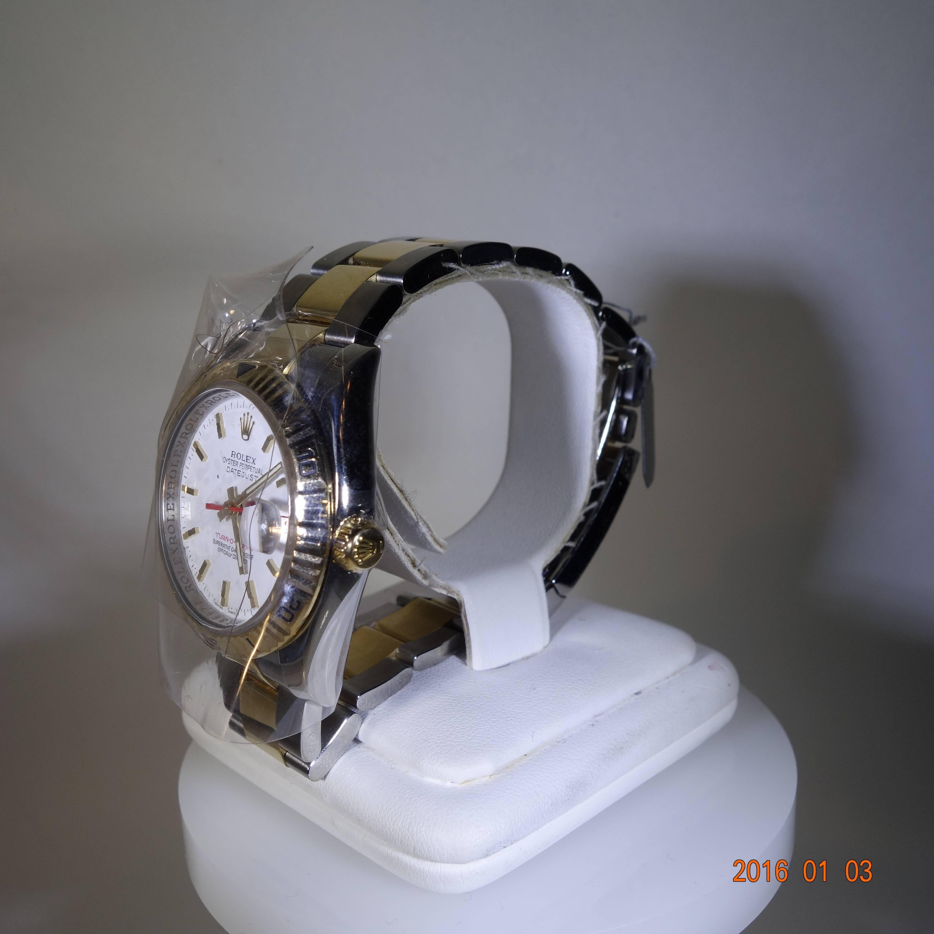 Ladies Tag Heuer Professional 200 meters.  This is a stainless steel 26 mm. circular face wrist watch with original Mother of Pearl crystal, a water resistant case and a screw down down and a quick-set date adjustment.  Retail price $2050.00