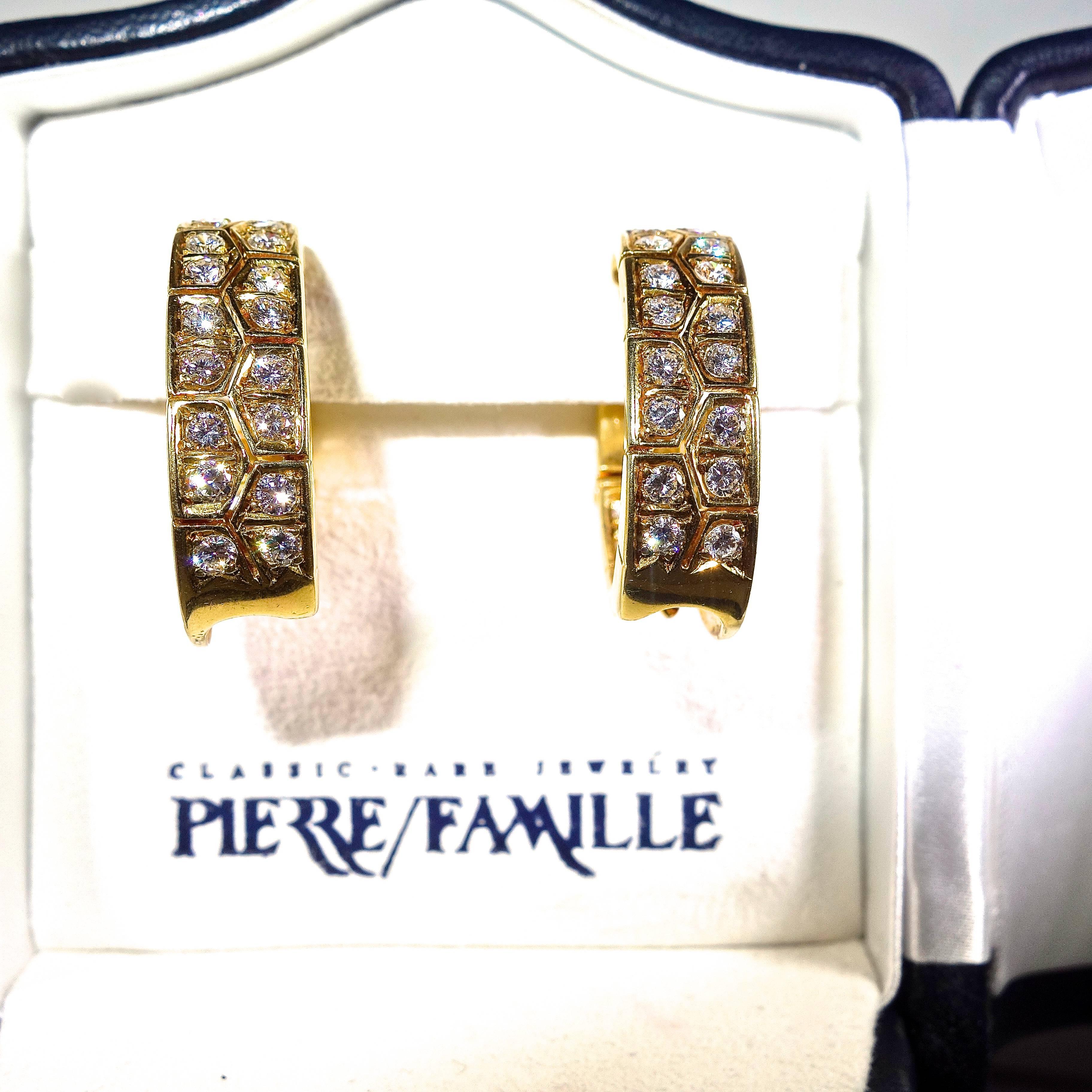 18K yellow gold stylized hoops with 60 diamonds weighing approximately 3 cts.  All of these diamonds are collection quality, D/E/F, VVS.  These earrings are signed and numbered with French hallmarks.  The diamonds are both on the inside and outside