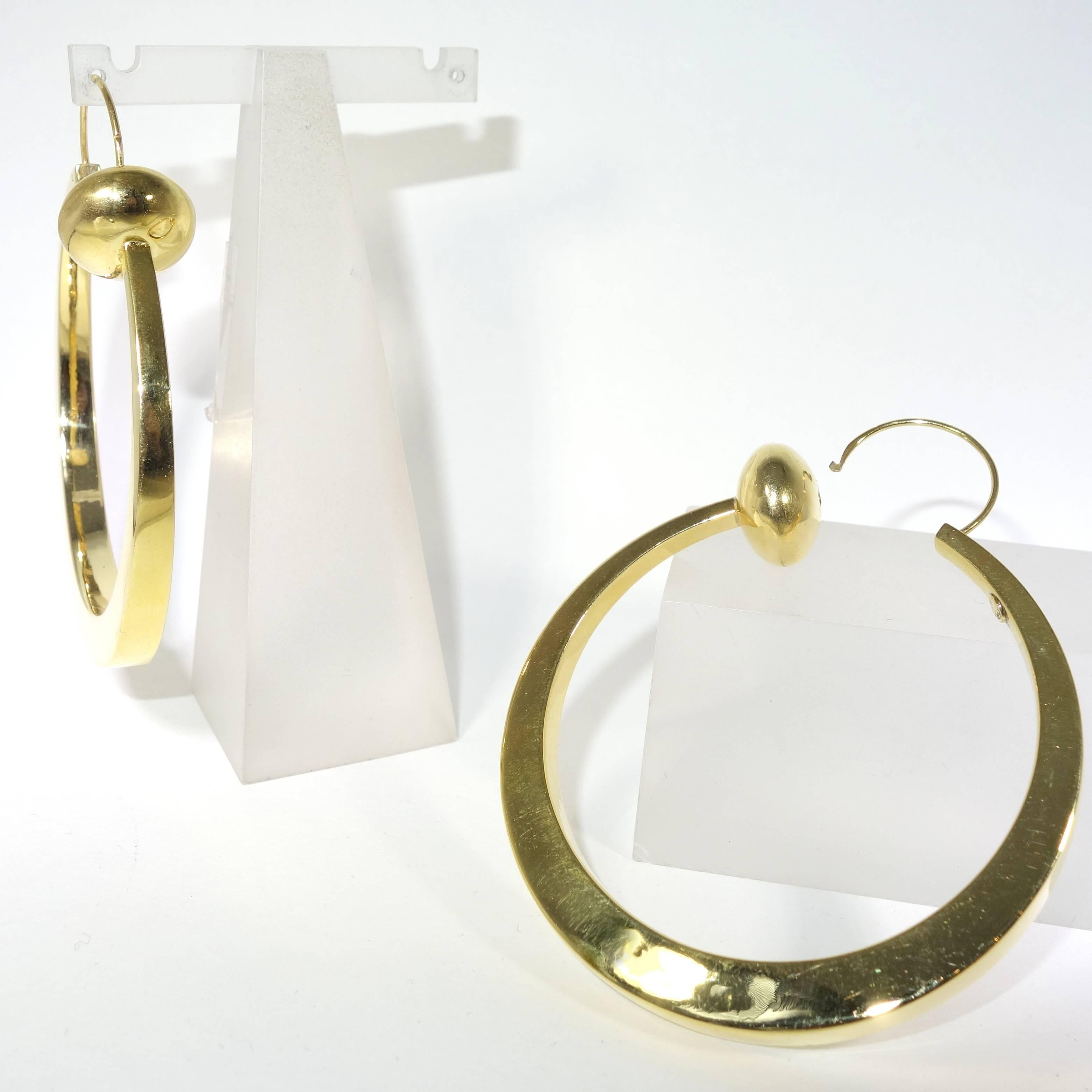 Large stylized gold hoop earrings, c. 1950. In Excellent Condition In Aspen, CO