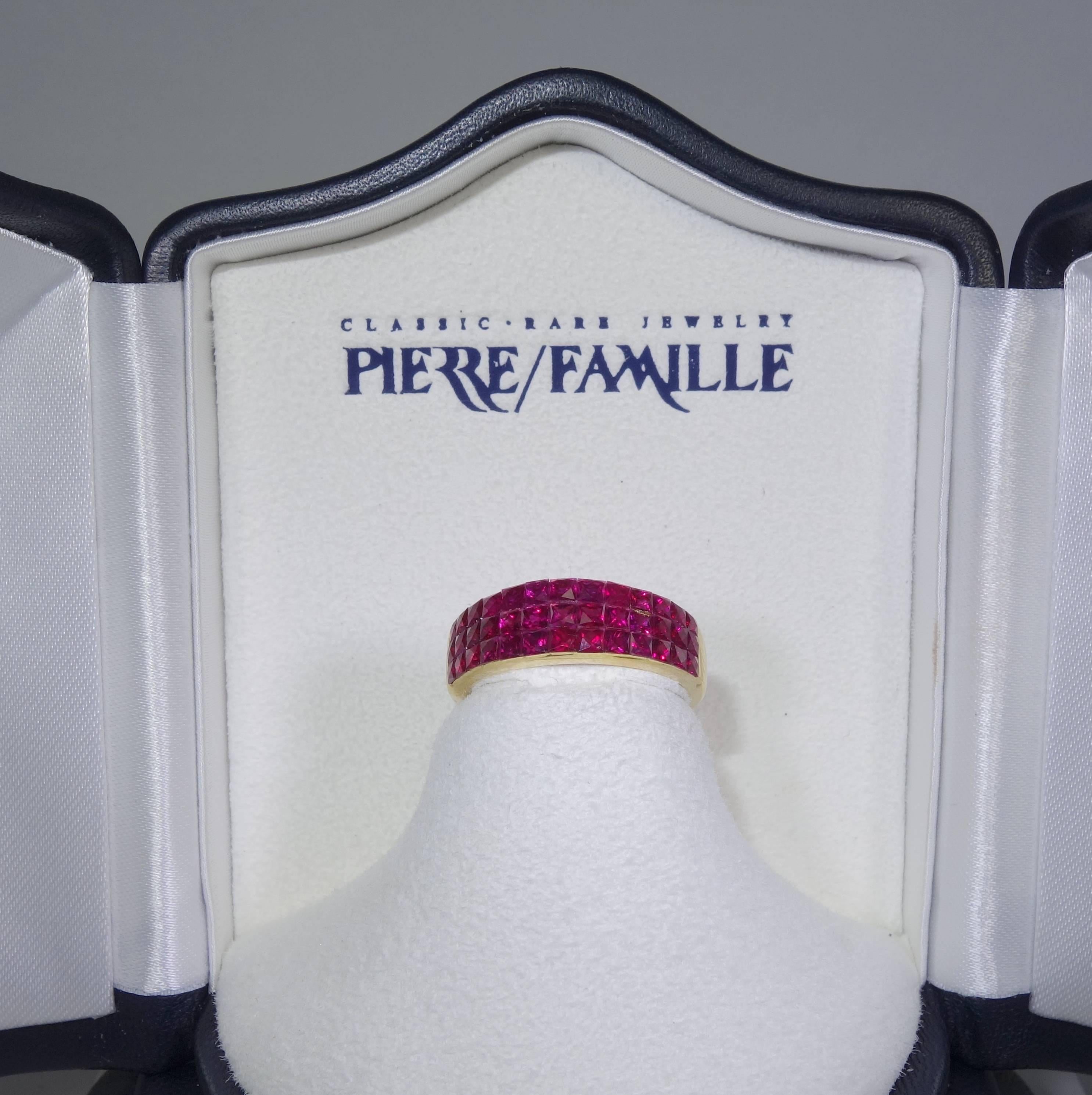 39 fine fancy cut French cut invisibly set natural vivid red rubies create a wonderful statement for the finger.  This 18K yellow gold band is now a size 6 and can be sized as the stones are only set on the top half.  The shank is marked 750 for 18K.