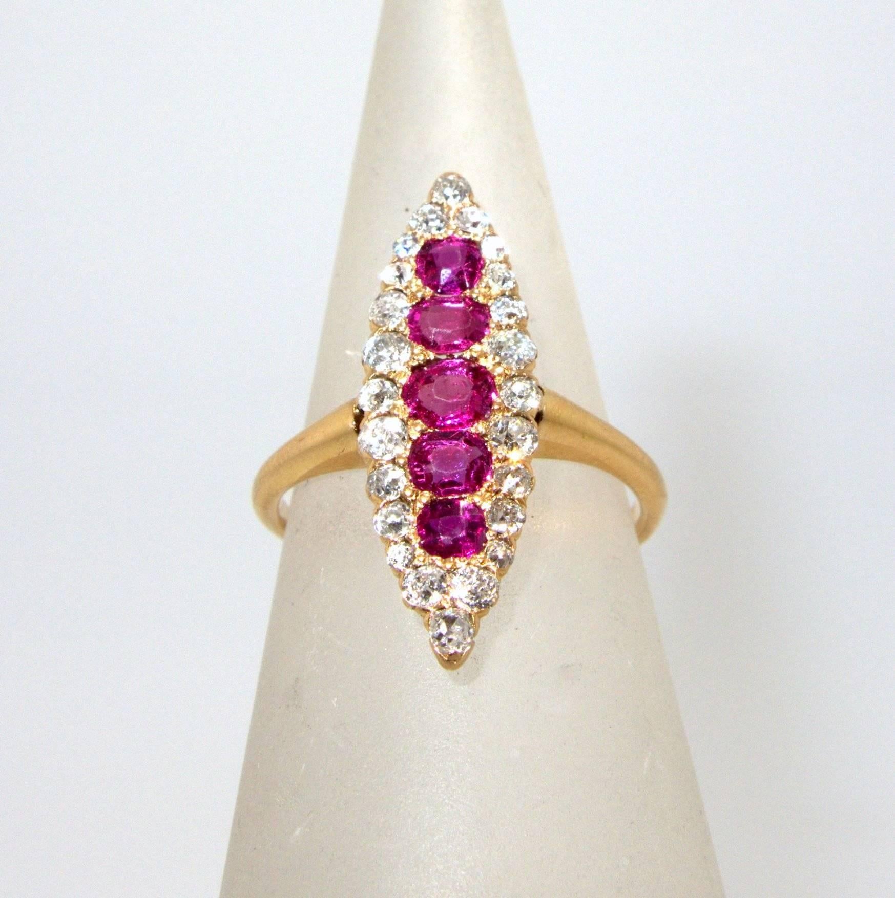Five natural unheated Burma rubies are surrounded by 24 old cut diamonds.  This navette shaped down the finger ring was made probably in America, circa1880.  The length is 26 mm., and the width 8.46 mm.  This ring is a size 5.5 and can easily be