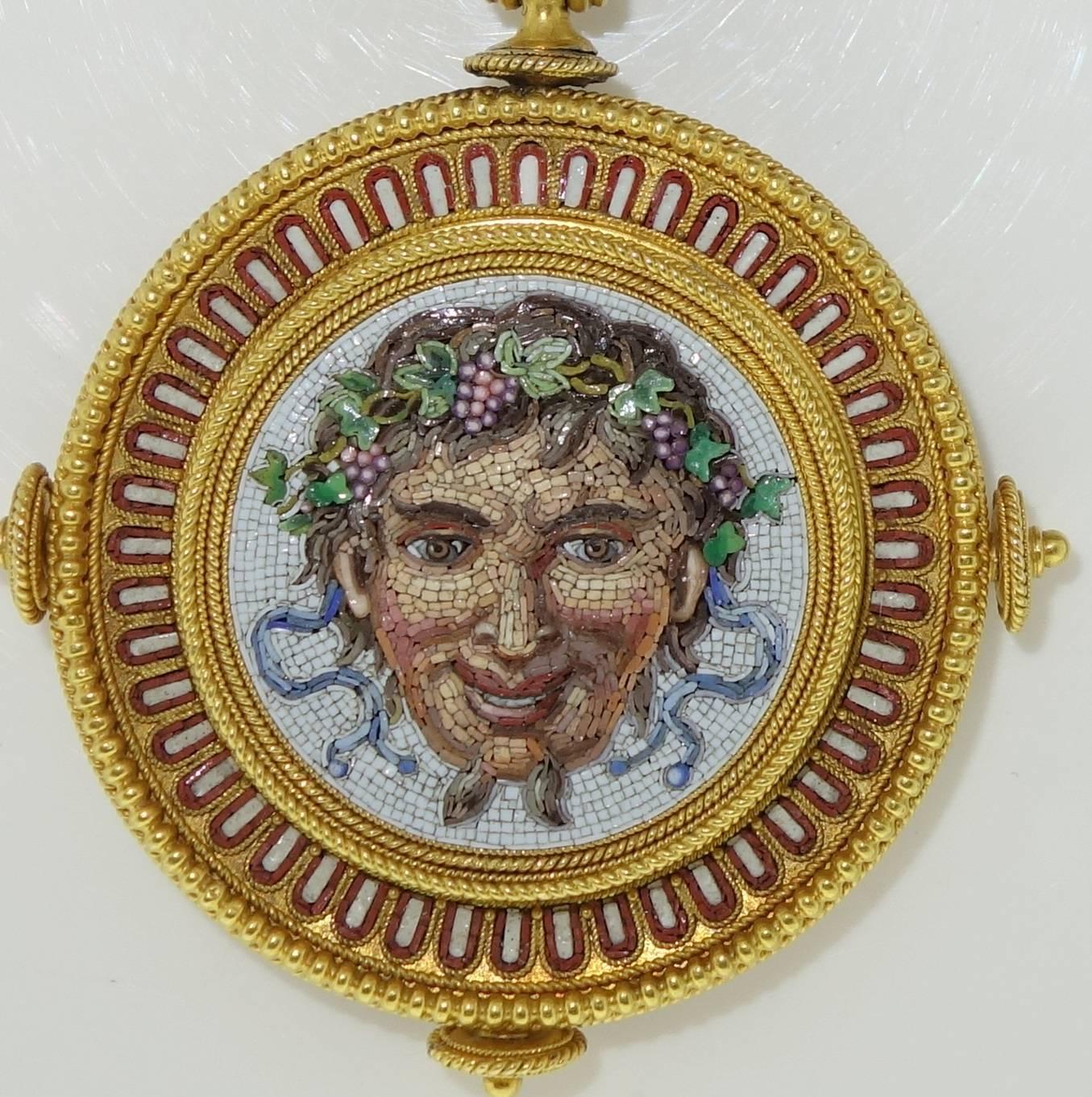 This necklace is a superb example of 19th century micro mosaic work.  18K, probably European, the Etruscan gold work is also quite fine.  The matching 18K chain is 17 inches long.  The pendant portion is 2.5 inches long.  The verso has a locket