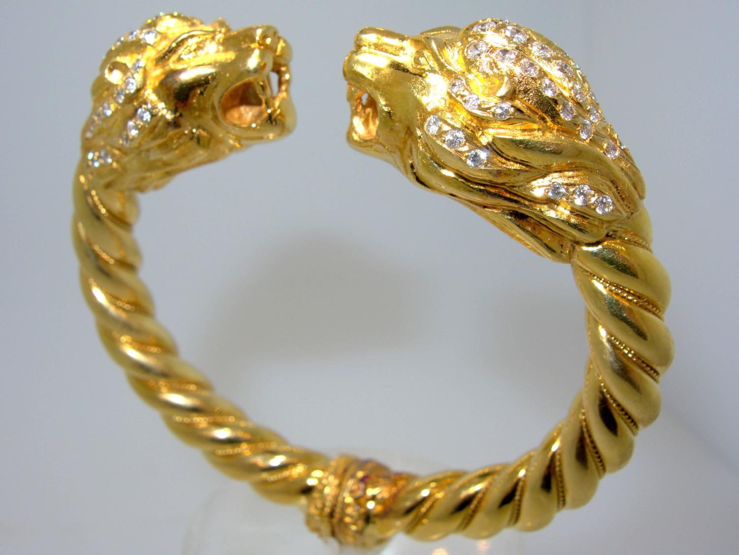 Lion's head gold bangle bracelet at 1stdibs