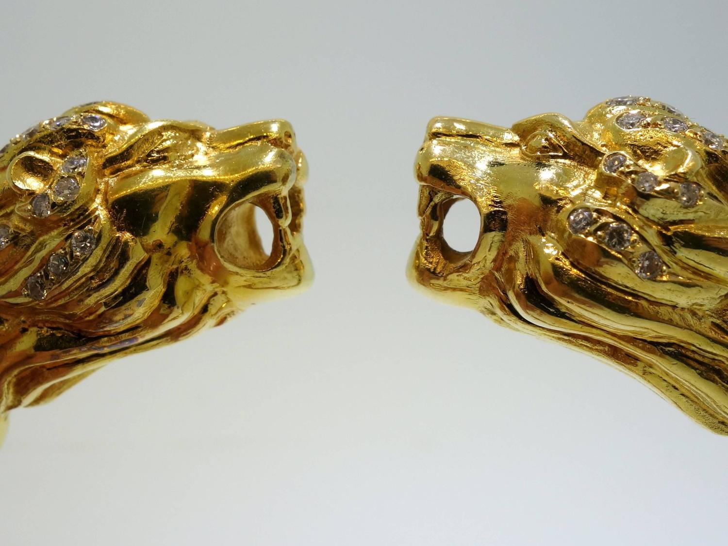 Lion's head gold bangle bracelet at 1stdibs