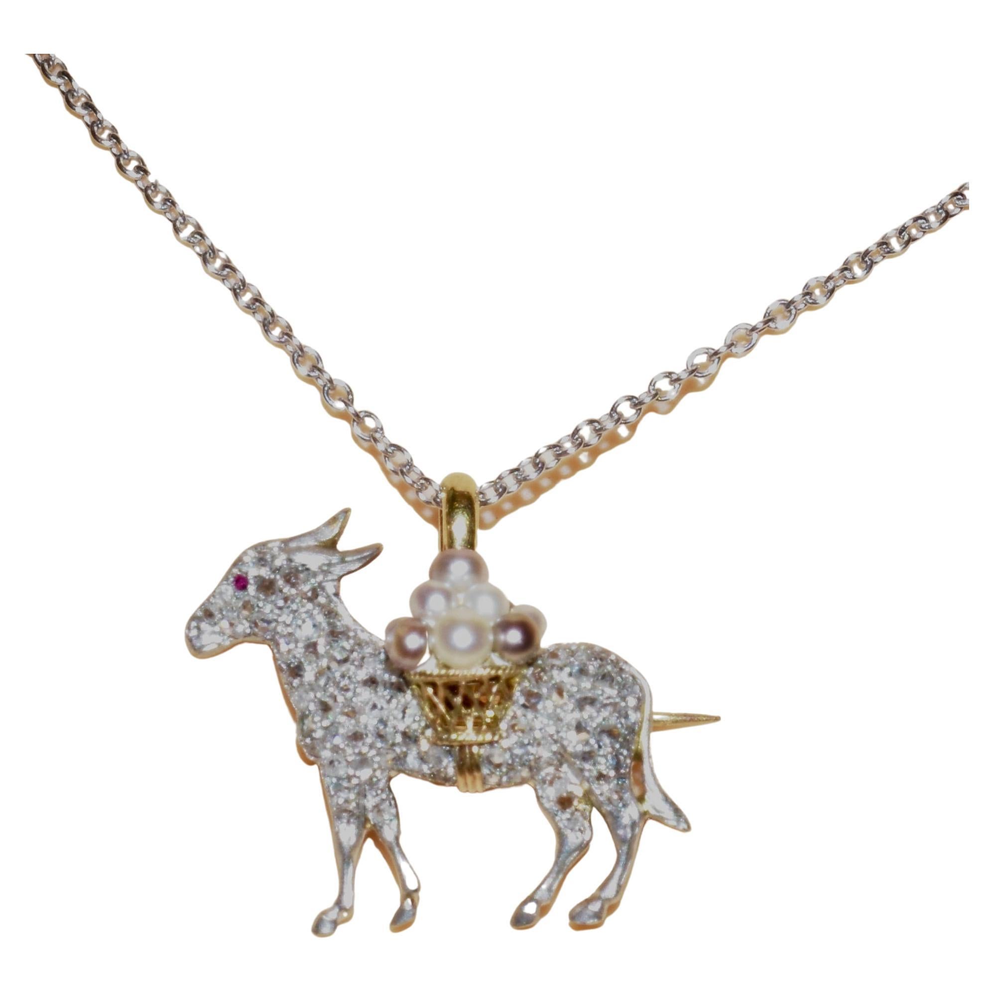 Antique brooch or pendant .  Mr. cute little burro is vertically .89 inches (to the top of his bale), or 22.61 mm., and horizontally .994 inches or 25.25 mm. Pave with rose cut diamonds.  Mr. burro has a natural Burma  ruby eye.  His handsome figure
