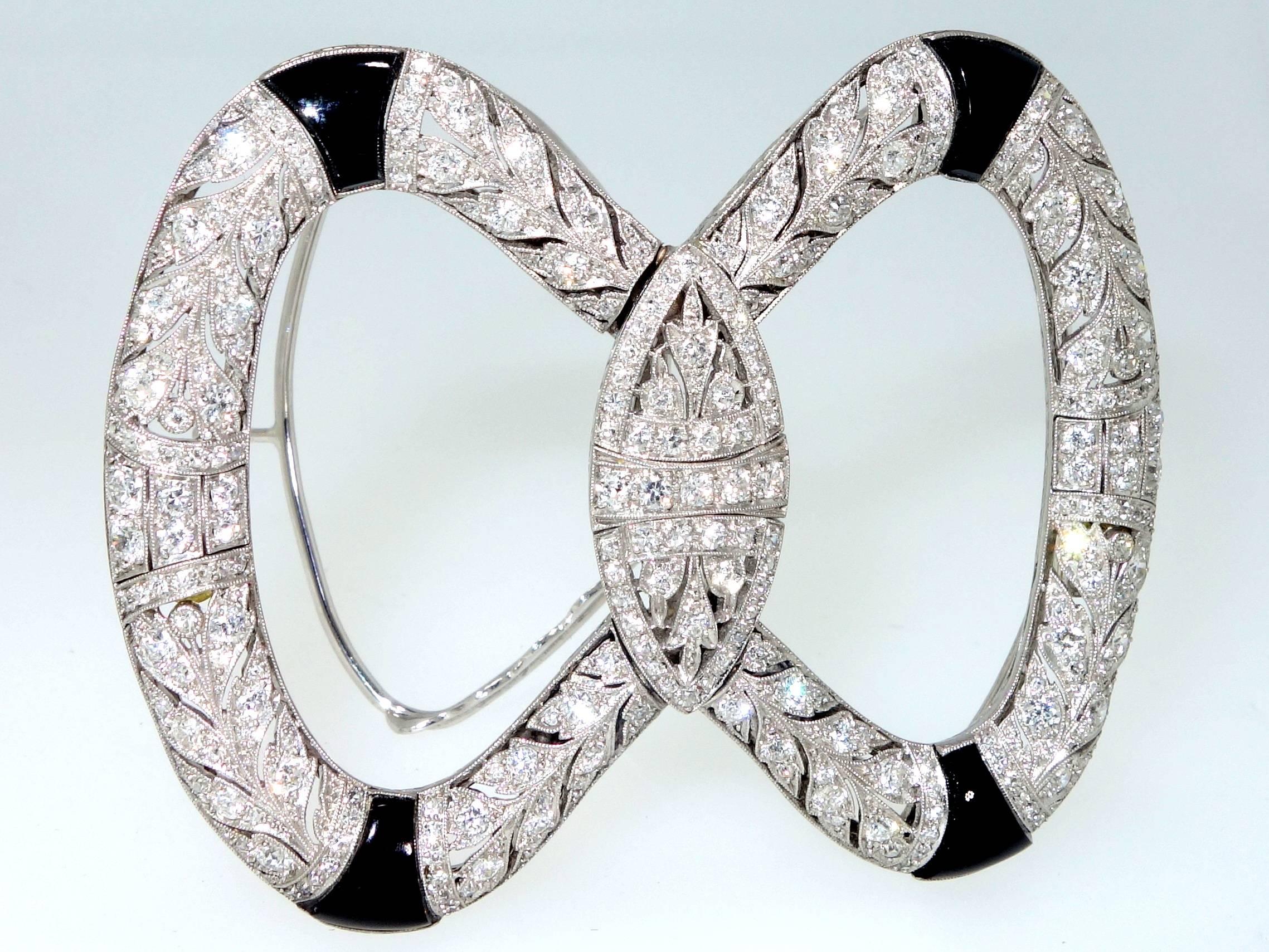European cut diamonds are set in fine platinum filigree work, this early Art Deco  piece has fancy cut onyx.  This piece is two inches in length and has two different and separate backs so that this piece can be worn in the hair as a ornament, or as