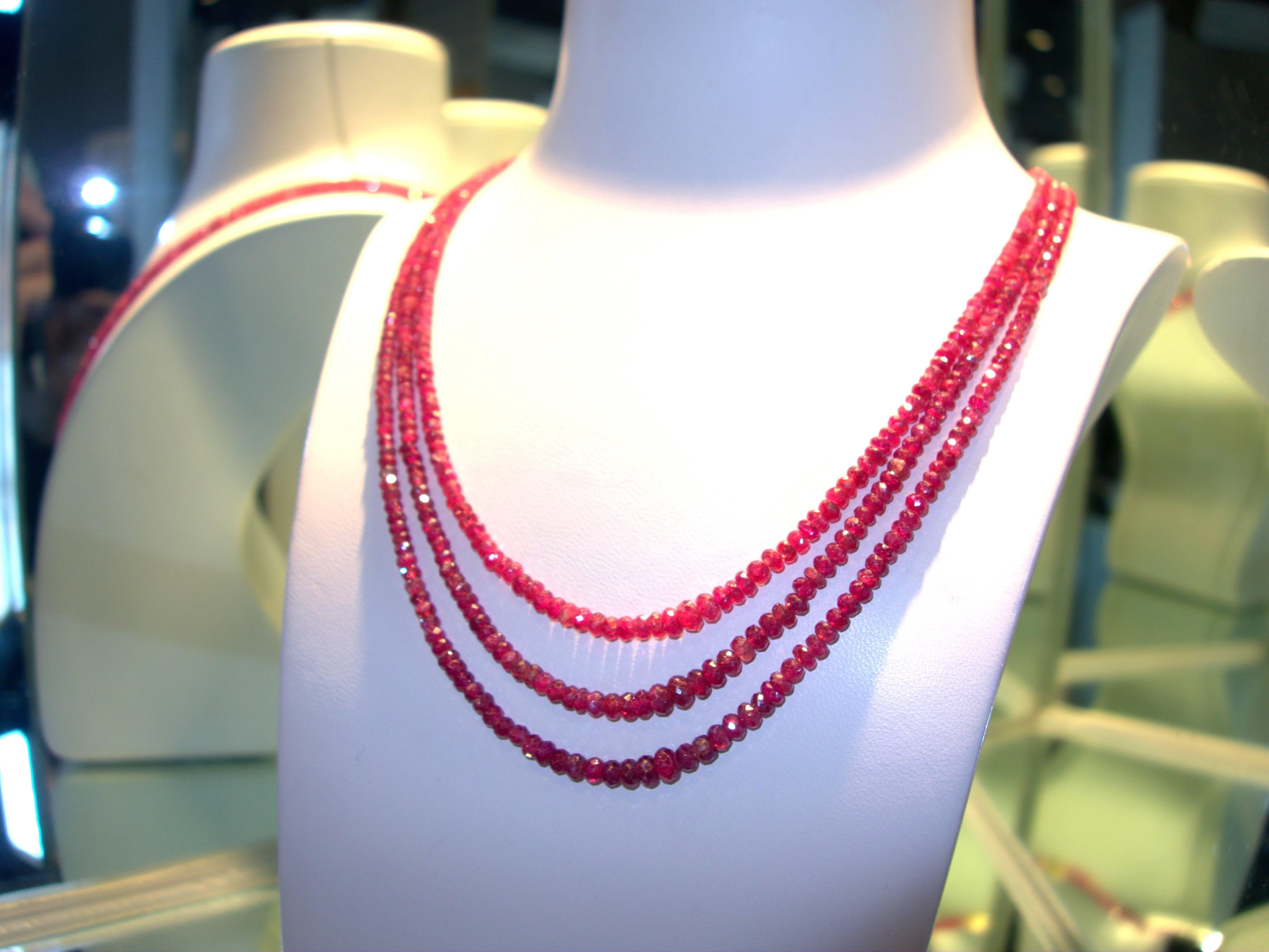 Finished with an 18K clasp, this three strand faceted ruby bead necklace is just over 20 inches in length.  It has approximately 200 cts of natural rubies.