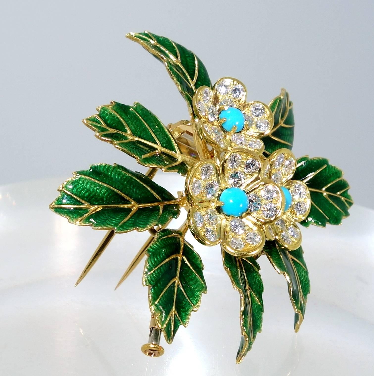 By the famous French House of Boucheron, this double clip brooch has green enameled leaves with a center of diamond and Persian turquoise flowers.  There are 45 diamonds will weigh approximately 1.95 cts., these diamonds are superb quality.  The