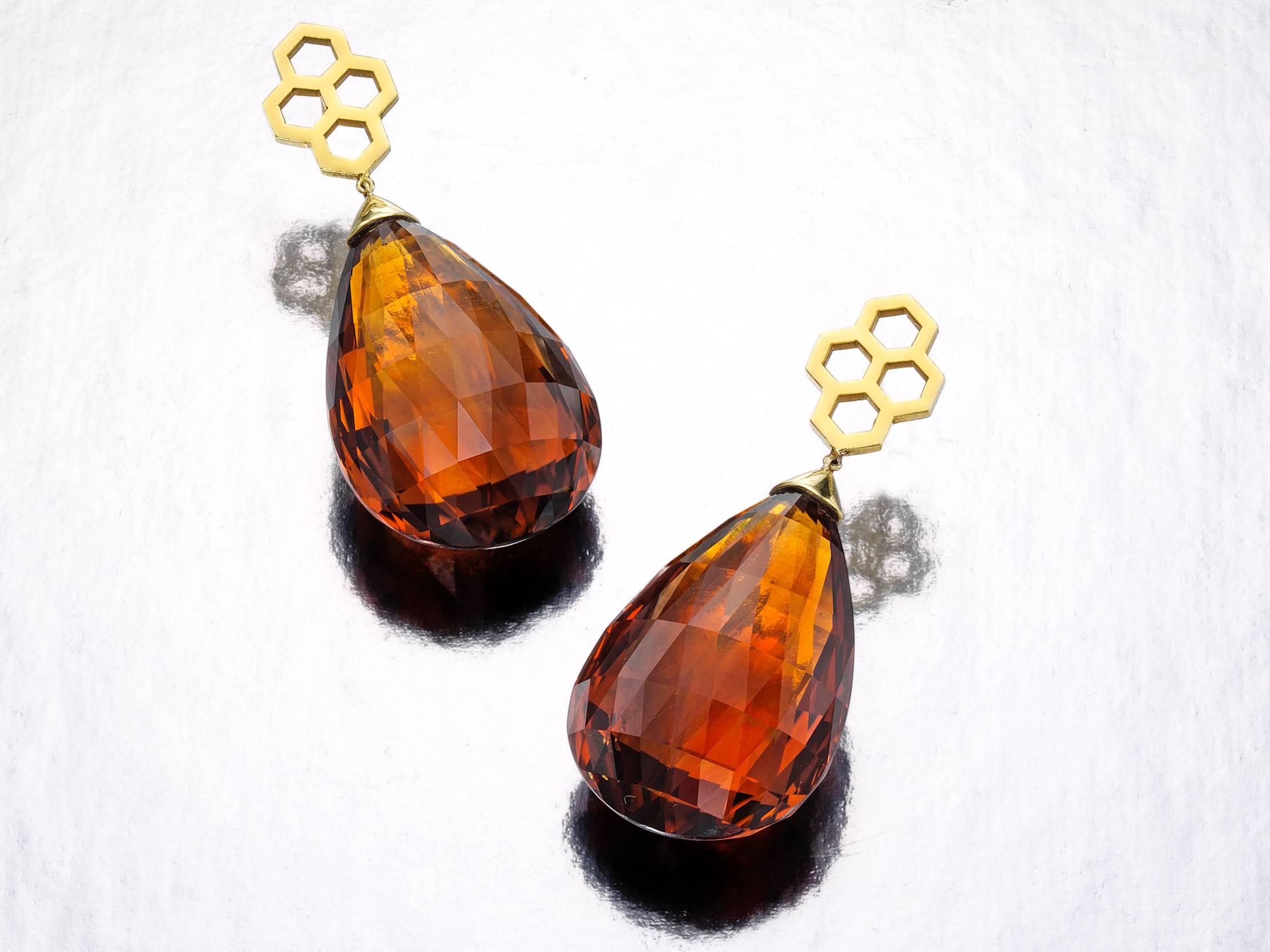 18K yellow gold with approximately 60 cts of clear and bright faceted tear drop shaped Madeira Citrines.  These earrings are two inches in length and contemporary in design.