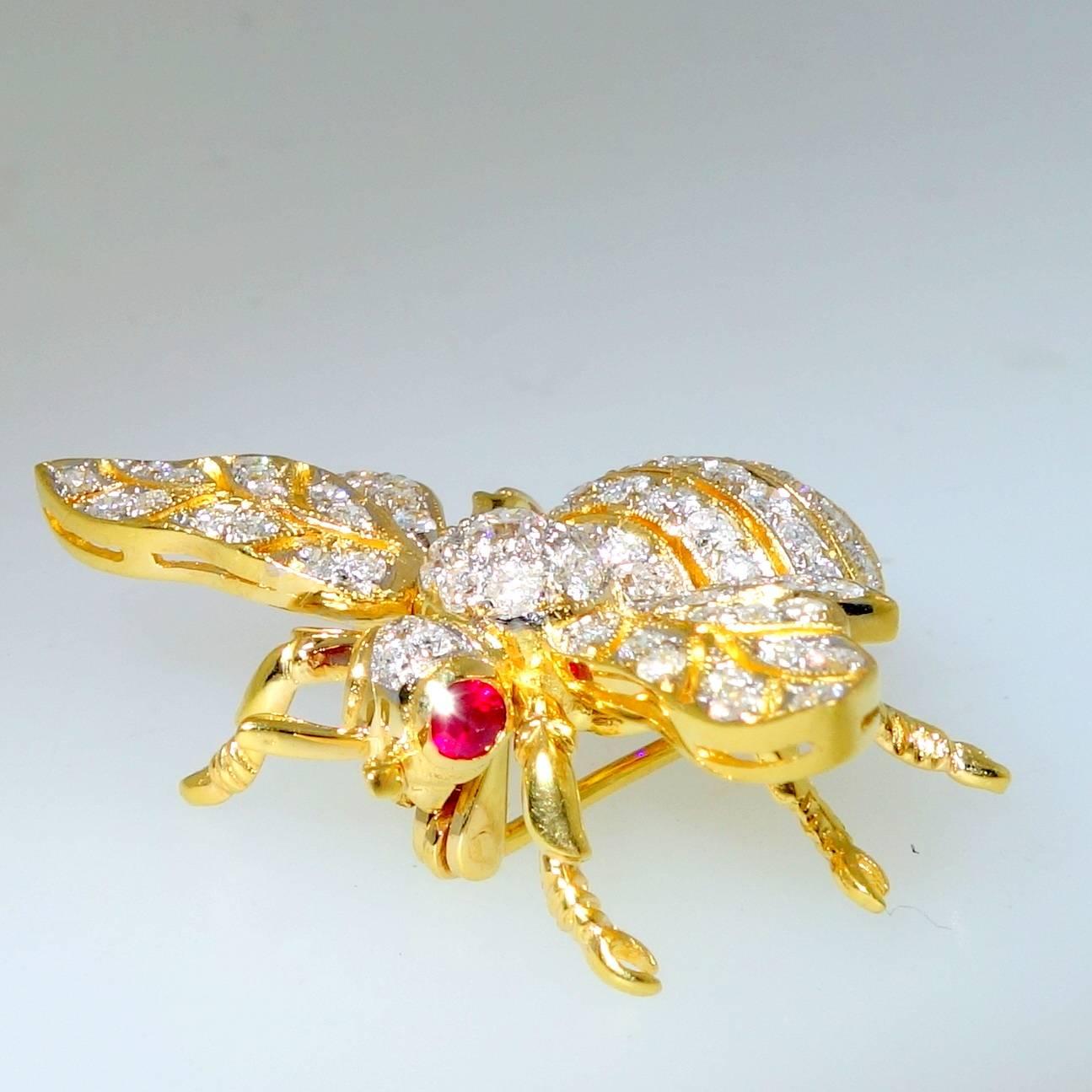 With just over 1 ct. of fine white diamonds, our little bumble bee has ruby eyes and is 18K yellow gold.  He is a nice size measuring over an inch and a quarter in diameter.